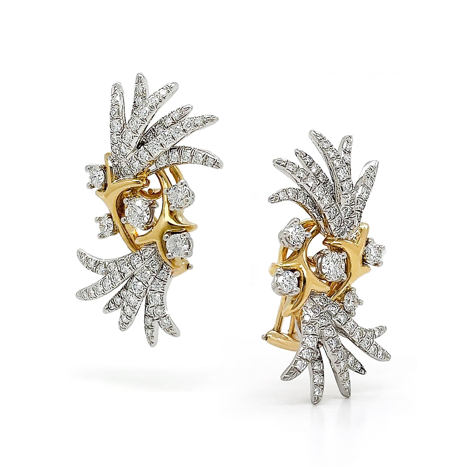 Sparkling diamonds erupt from vivid 18k yellow gold in these earrings. Rays of platinum set brilliant cut diamonds overlap and extend from within the V-shape of a tapered 18k yellow gold design. 18k yellow gold is the only combination with the most