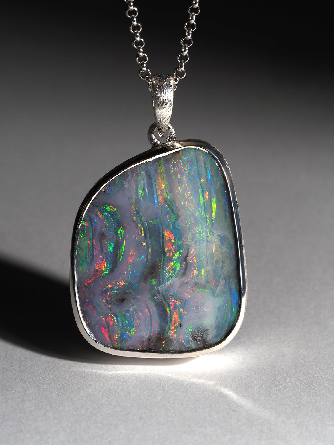 Large silver pendant with natural fine quality Boulder Opal
gemstone origin - Australia
gem size is 0.87 x 1.10 in / 22 x 28 mm
stone weight - 32 carats
pendant length - 1.54 in / 39 mm
pendant weight - 17 grams 