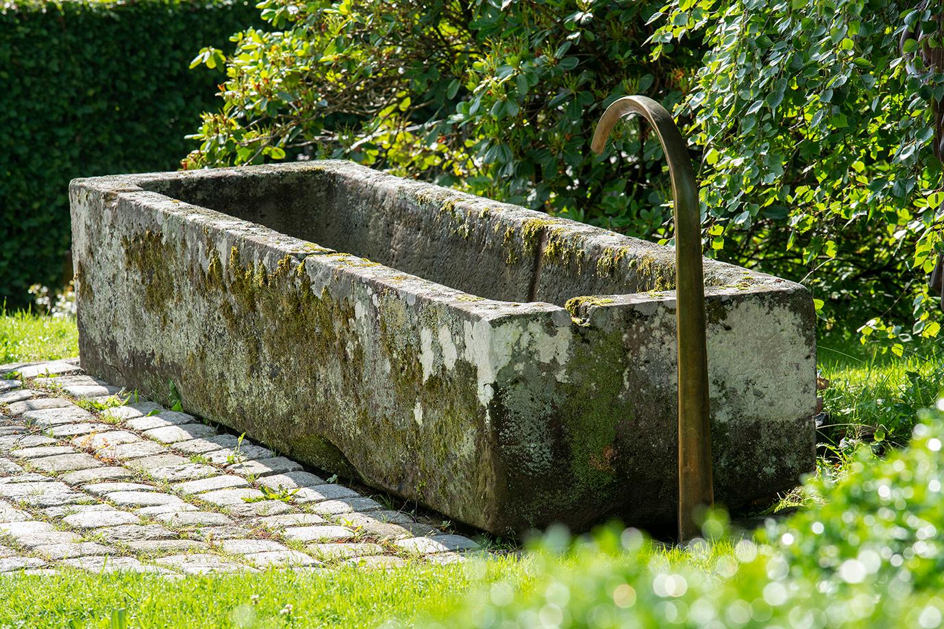 On these pictures you can see an antique fountain with a beautiful patina.
The fountain is 310cm x 90cm x 60cm
Pictured spout is out of brass can be designed as desired.
The fountain is ready to use and beautiful not just in beauty but quality as