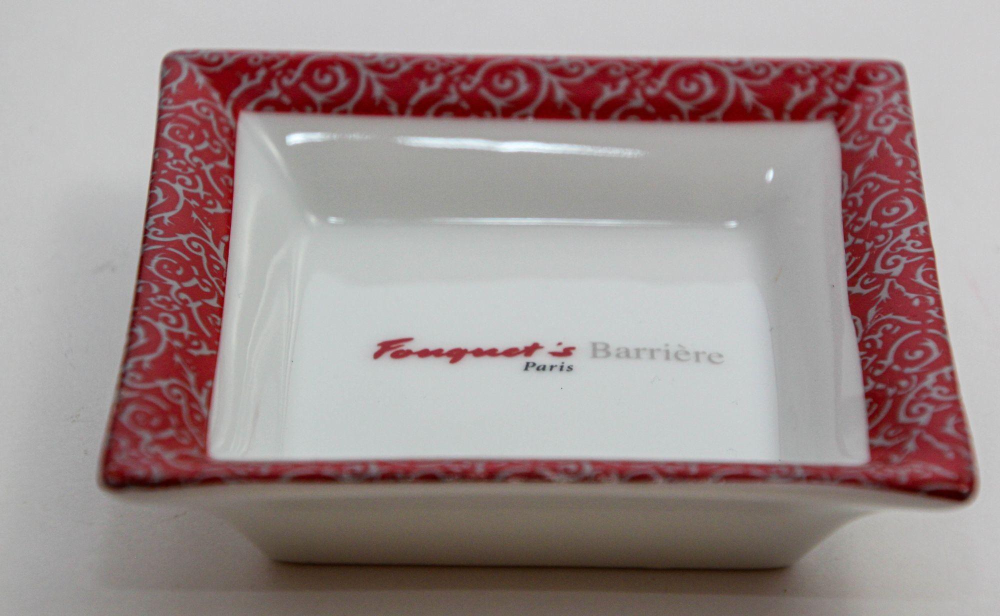 Vintage French Porcelain Ashtray from Fouquet's Paris, 1980s.
This collectible ashtray, crafted in red and white square porcelain.
Ideal as both an ashtray and a stylish decorative dish or catchall.
The Fouquet's Paris souvenir ashtray trinket