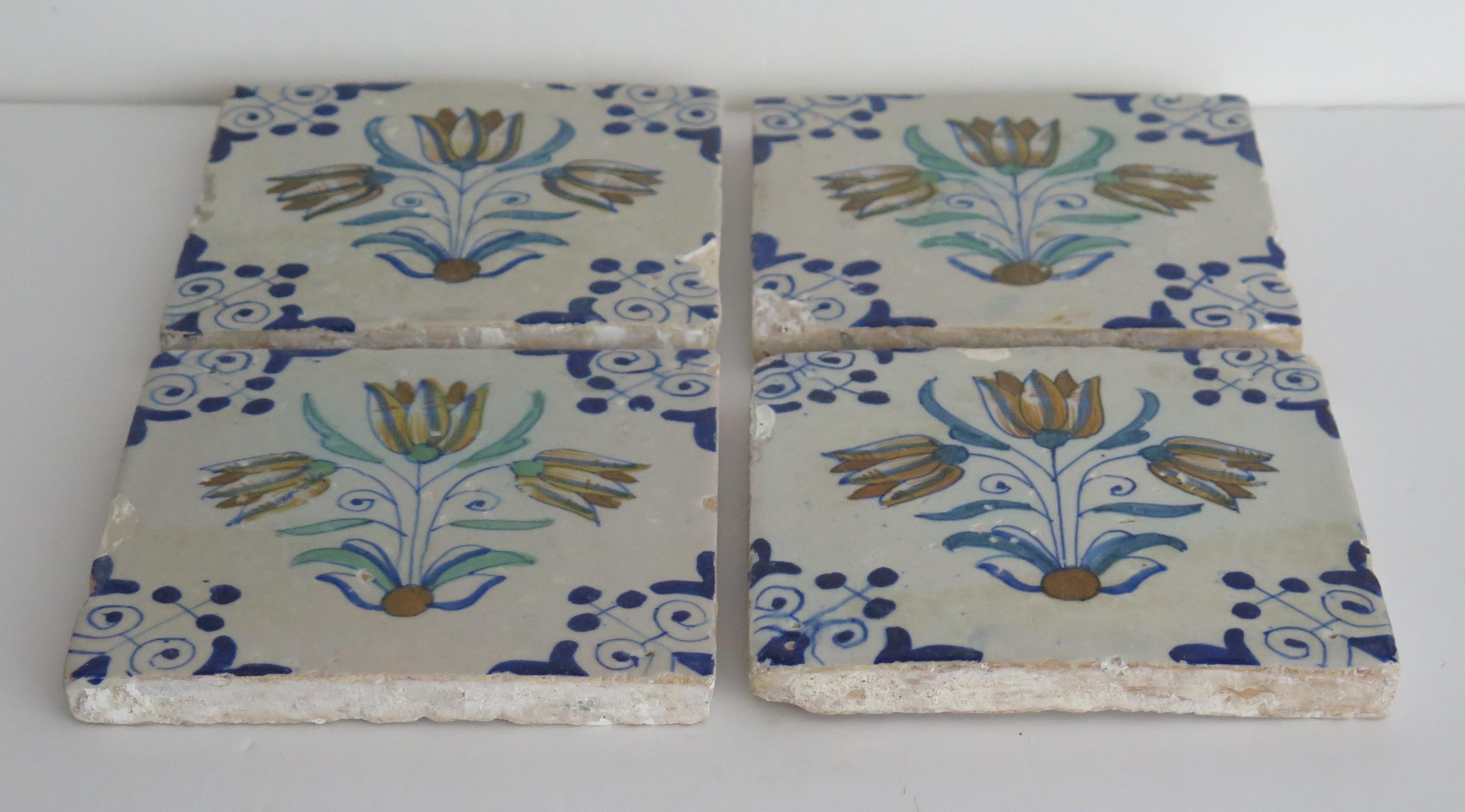 These are a set of four very attractive similar, Dutch (Netherlands), delft Polychrome, blue and white hand painted earthenware ceramic wall tiles dating to the early 17th century.

All tiles are nominally 5 inches square and 1/2 inches thick.