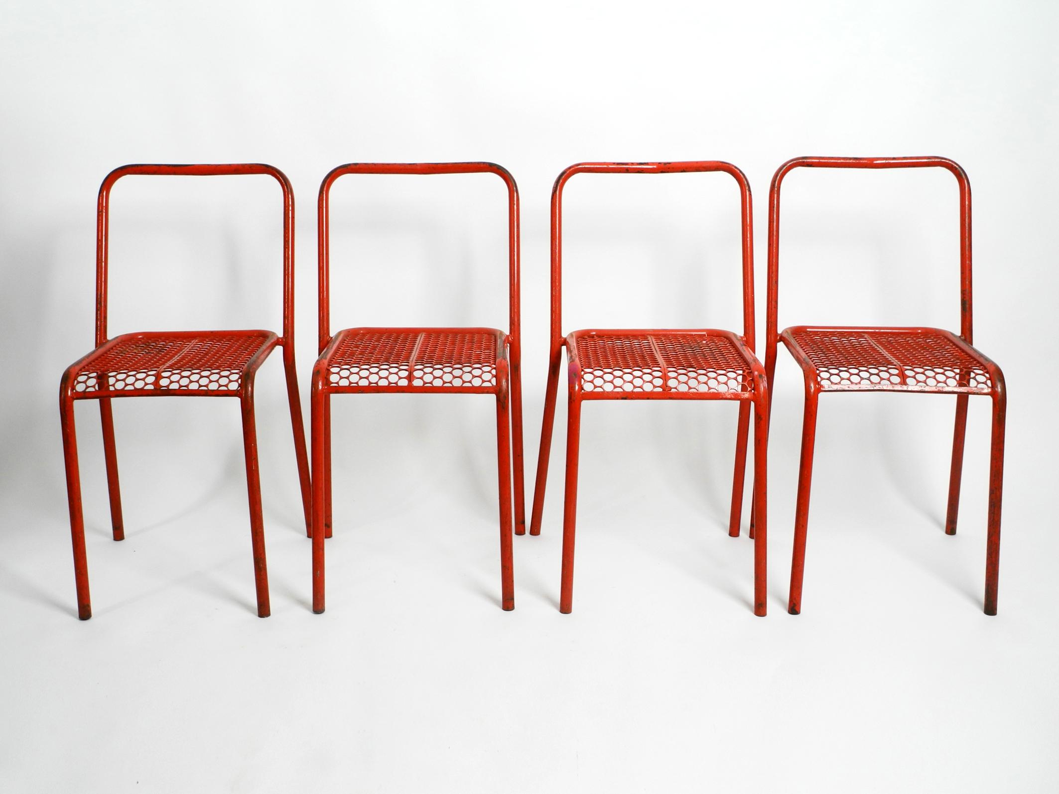 Four 1940s industrial design metal chairs by Réne Malaval in their original colors.
The welder Rene Malaval designed some of the best industrial designs in France after the war. 
Malaval made beautiful chairs from scrap metal, a by-product of