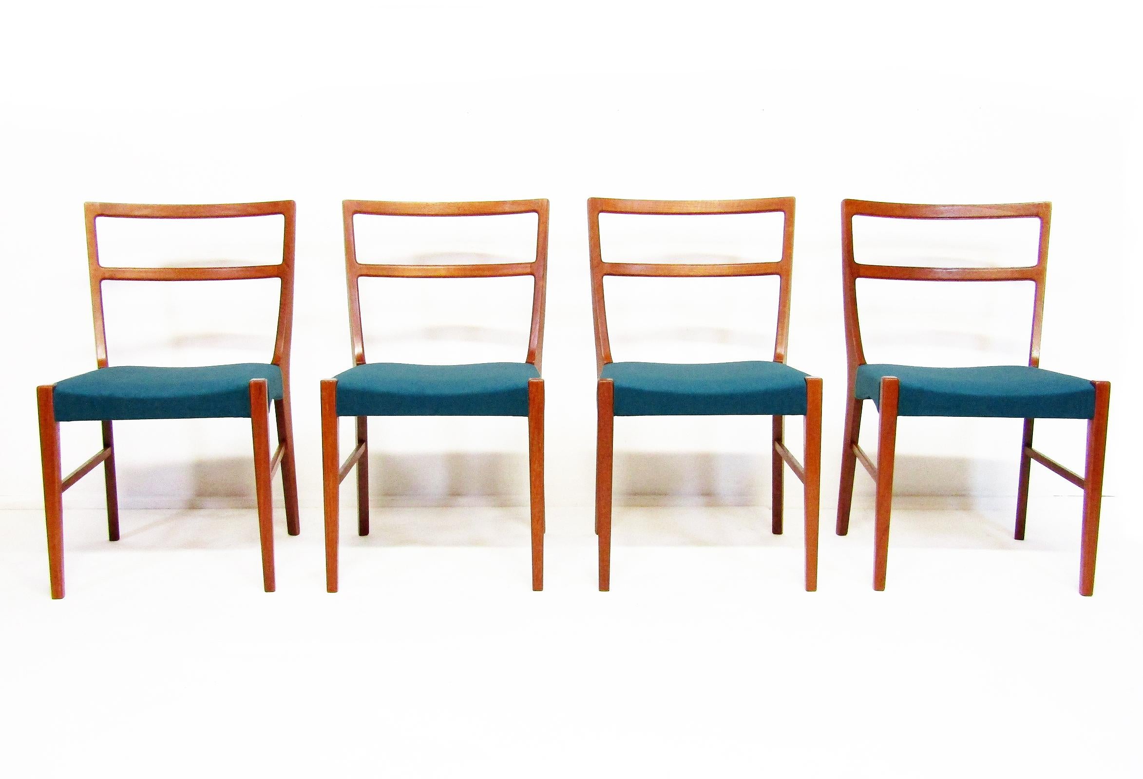 A set of four 1960s Danish dining chairs in teak by Johannes Andersen for Bernhard Pedersen & Sons.

The understated quality belies the sophistication of these chairs. The fine contours of the backrest and subtle taper of the legs create a design