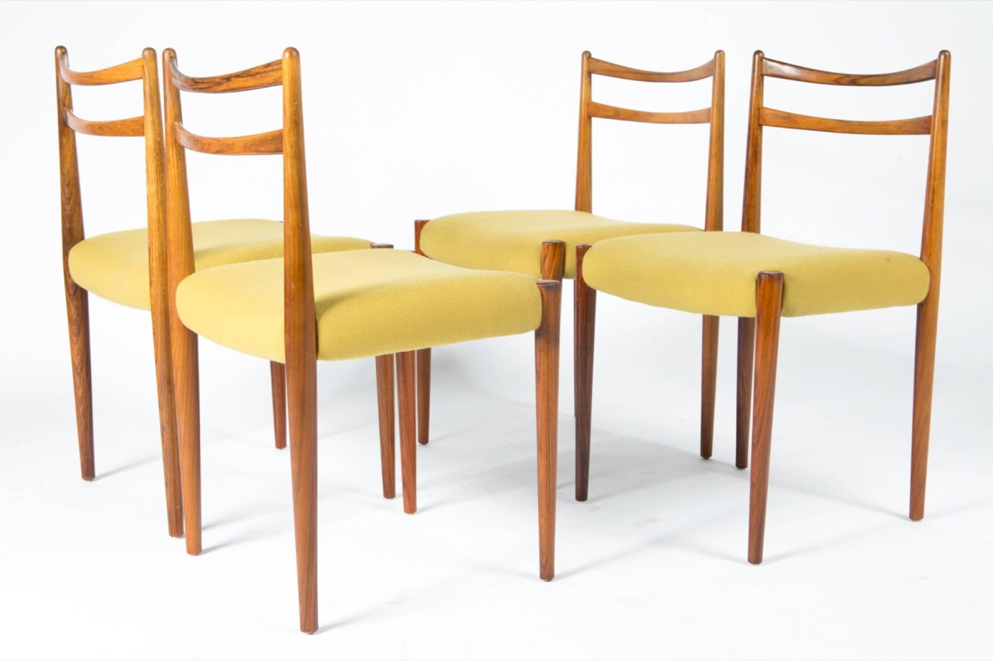 Four 1960s yellow original fabric rosewood Danish modern chairs. Elegant design.