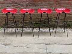 Four 1970s Iron Tractor Seat Stools Manner of Rodney Kinsman