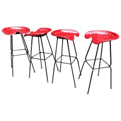 Four 1970s Iron Tractor Seat Stools Manner of Rodney Kinsman