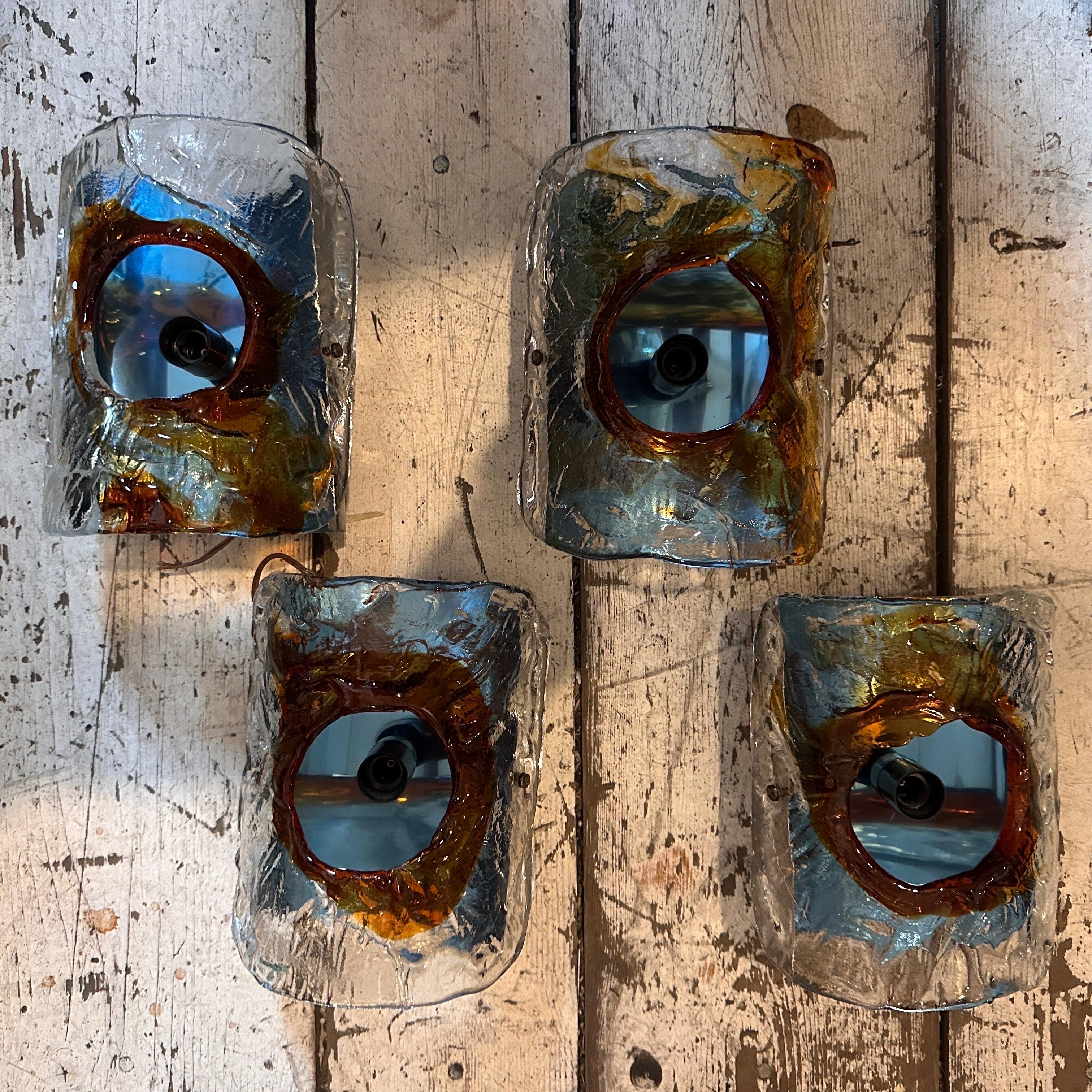 Four orange and brown murano glass and steel wall sconces designed and manufactured with love in the Space Age Era by Mazzega, they have been checked by an electrician and are in perfect working order. the sconces exemplify the dynamic and