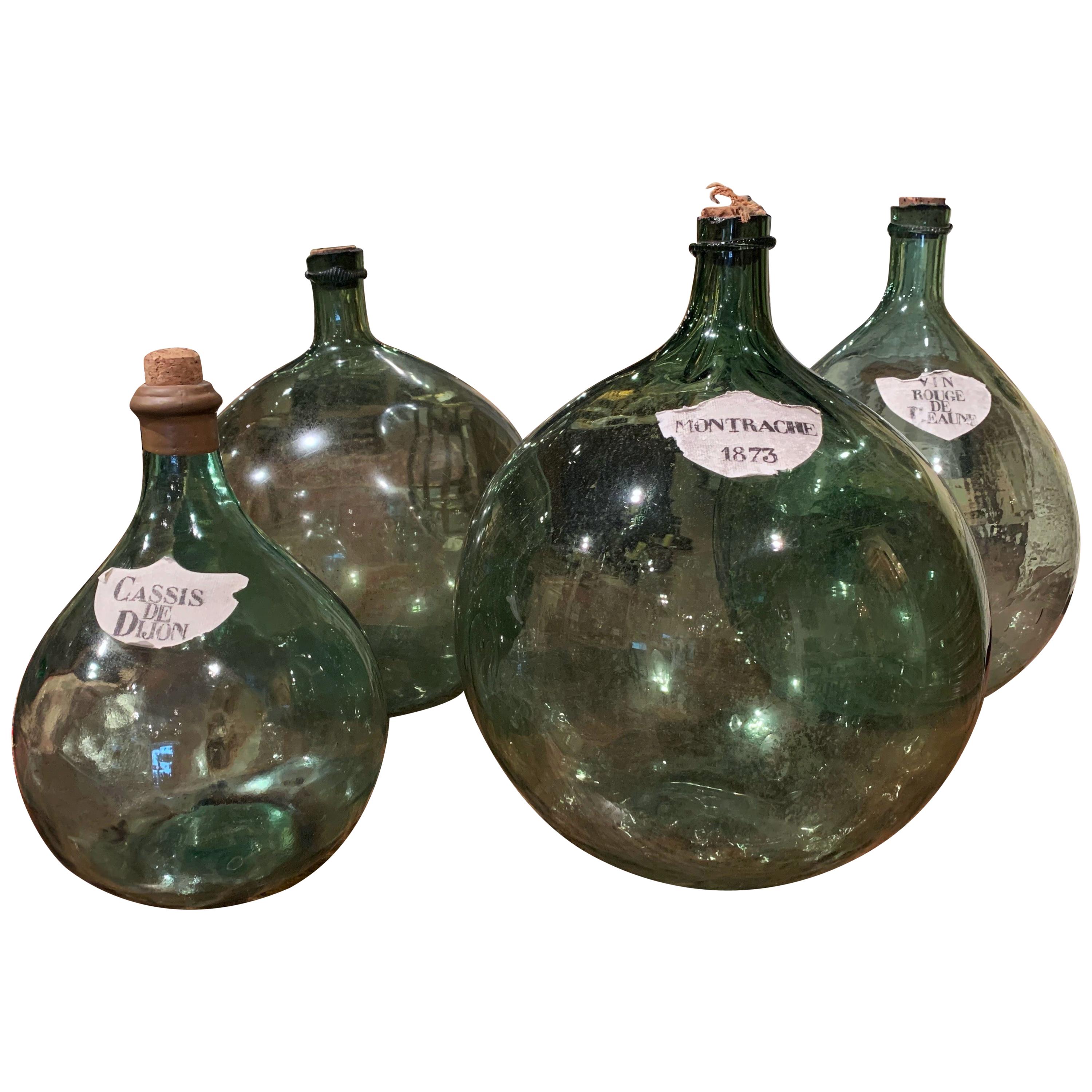 Four 19th Century French Hand Blown Glass Wine Bottles with Decorative Labels