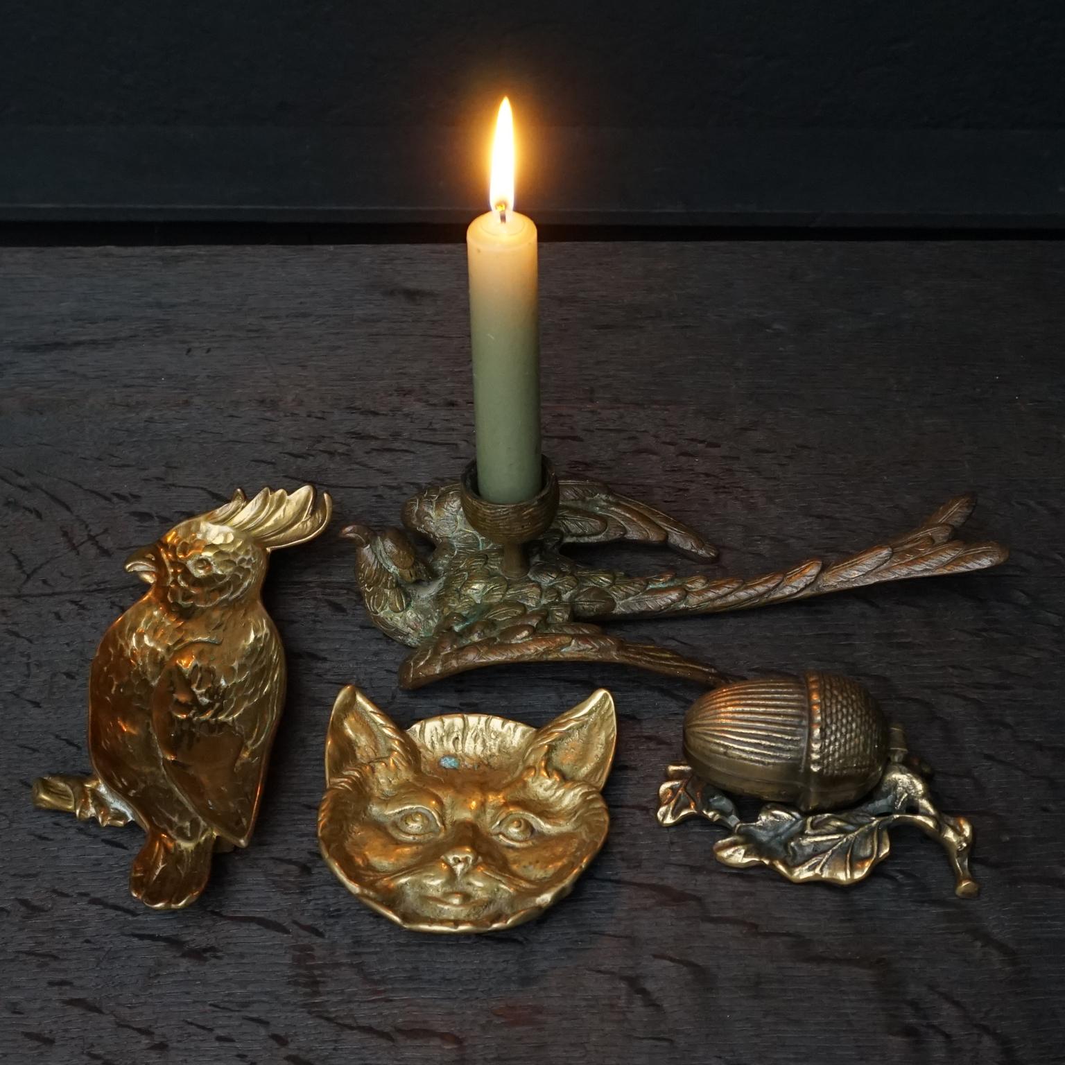 Decorative collection of four little brass vide-poche trinket dishes and a candleholder to keep or collect your little trinkets in and shine a little light on your lovelies.

Use them to put your jewelry in on your nightstand before going to