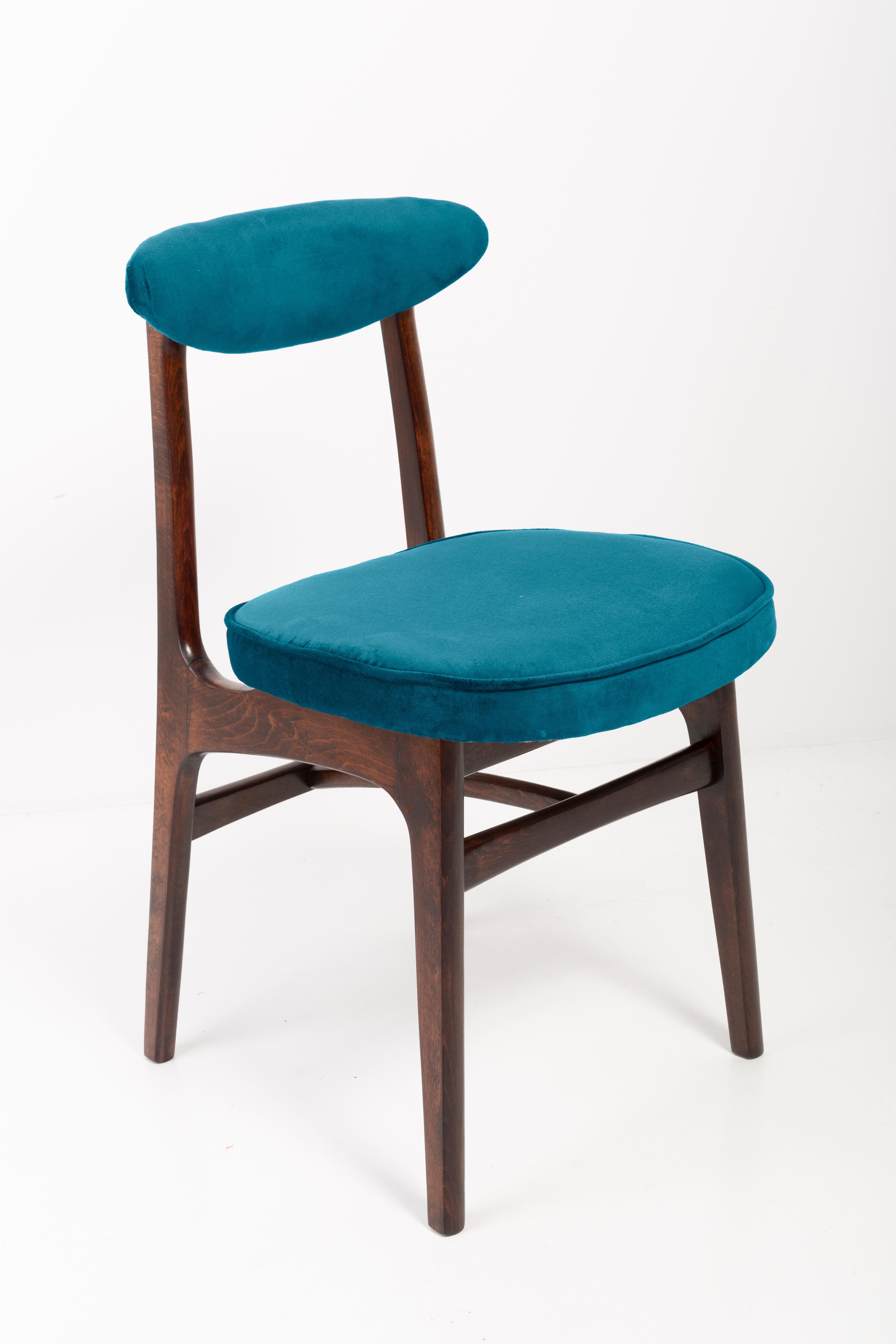 Four chairs designed by Prof. Rajmund Halas. It has been made of beechwood. Chairs are after undergone a complete upholstery renovation, the woodwork has been refreshed. Seats and backs were dressed in a petrol blue (color 973), durable and pleasant