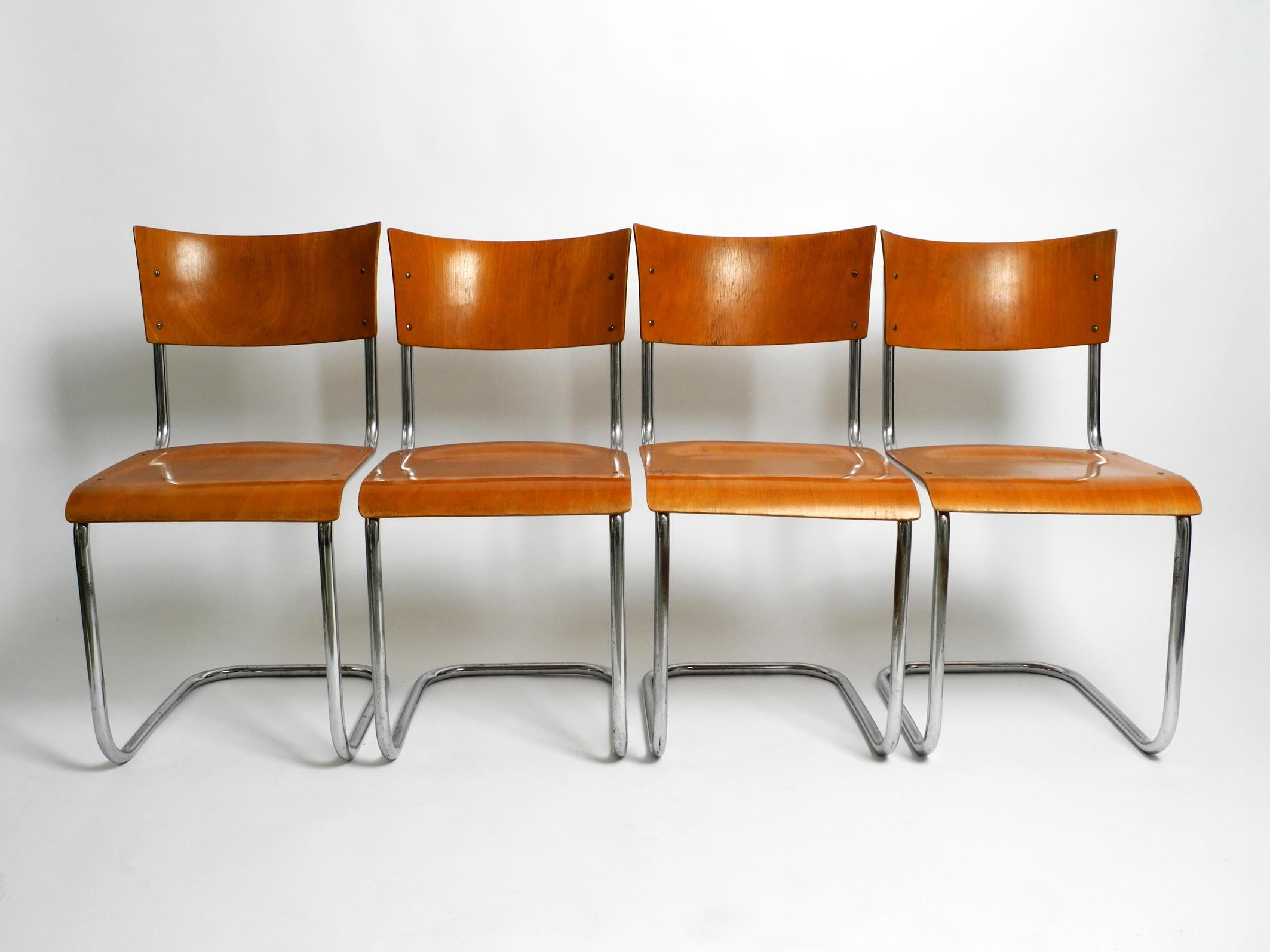 Four 1930s cantilever tubular steel Bauhaus chairs.
Design by the well-known Dutch architect Mart Stam.
Manufacturer is furniture factory Robert Slezak. Made in Czech.
Seat and backrest are made of plywood.
All four chairs are in the same very good
