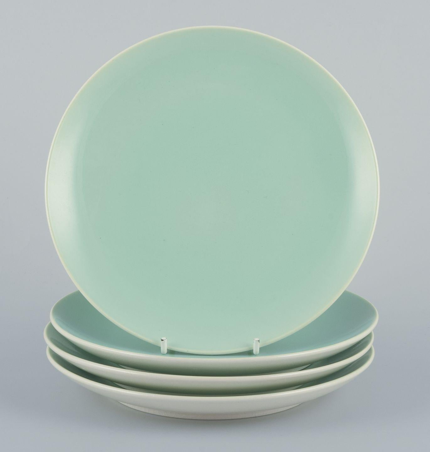 Cuatro platos Aluminia "Confetti" de loza vidriada verde menta. Mediados del siglo XX