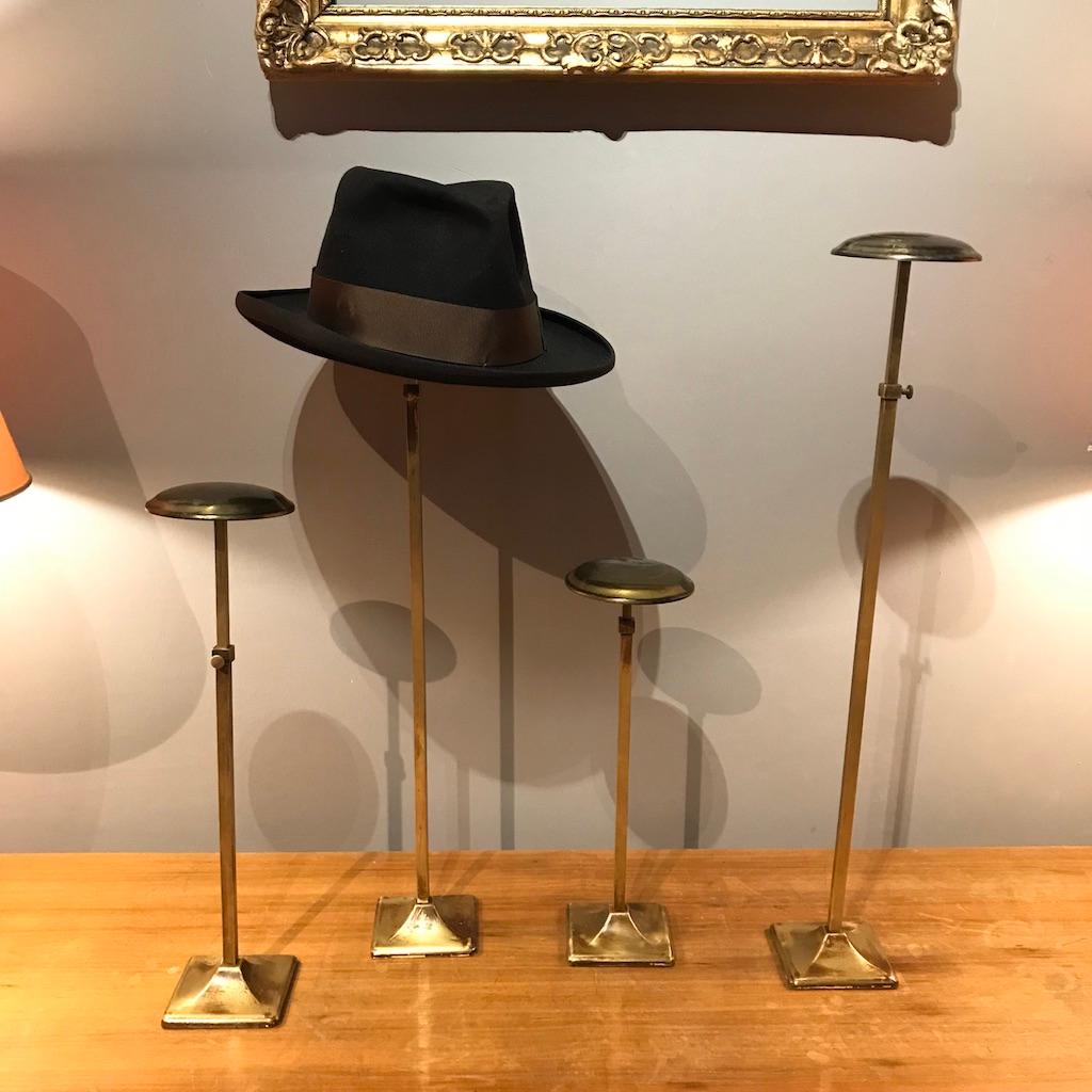 Four antique and unique French display stands handmade of brass attributed to 