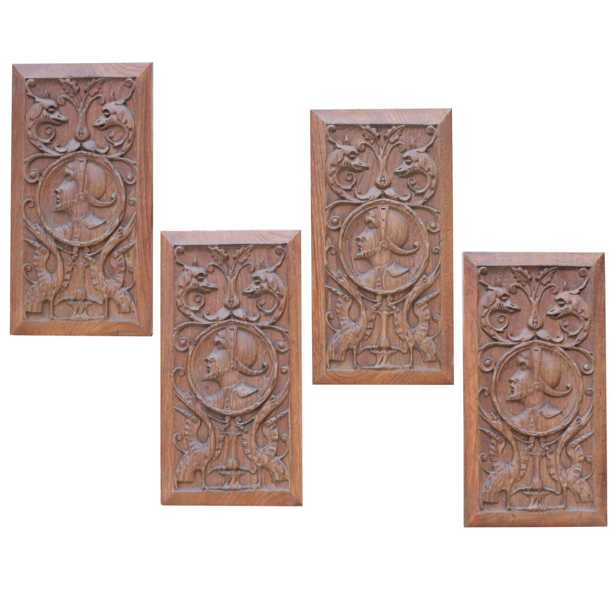 Four Antique Carved Oak Panels Depicting Figures in Period Costume