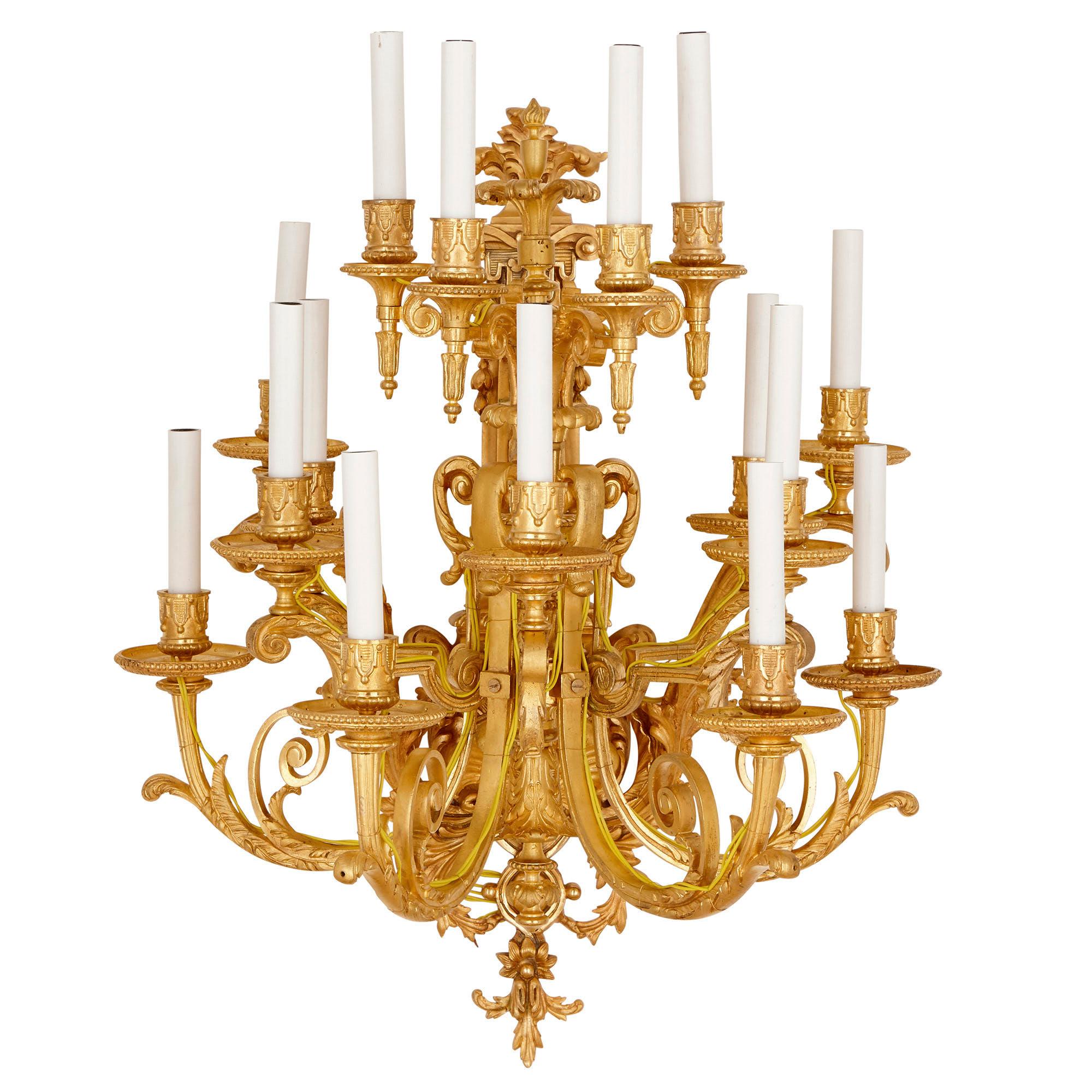 These gilt bronze (ormolu) wall sconces are magnificent pieces, each holding fifteen lights. The sconces will look beautiful either mounted onto the wall in a line, or paired and placed either side of a large mirror or doorway. 

The lights