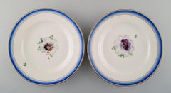 Four Antique Royal Copenhagen Plates in Hand Painted Porcelain with Flowers