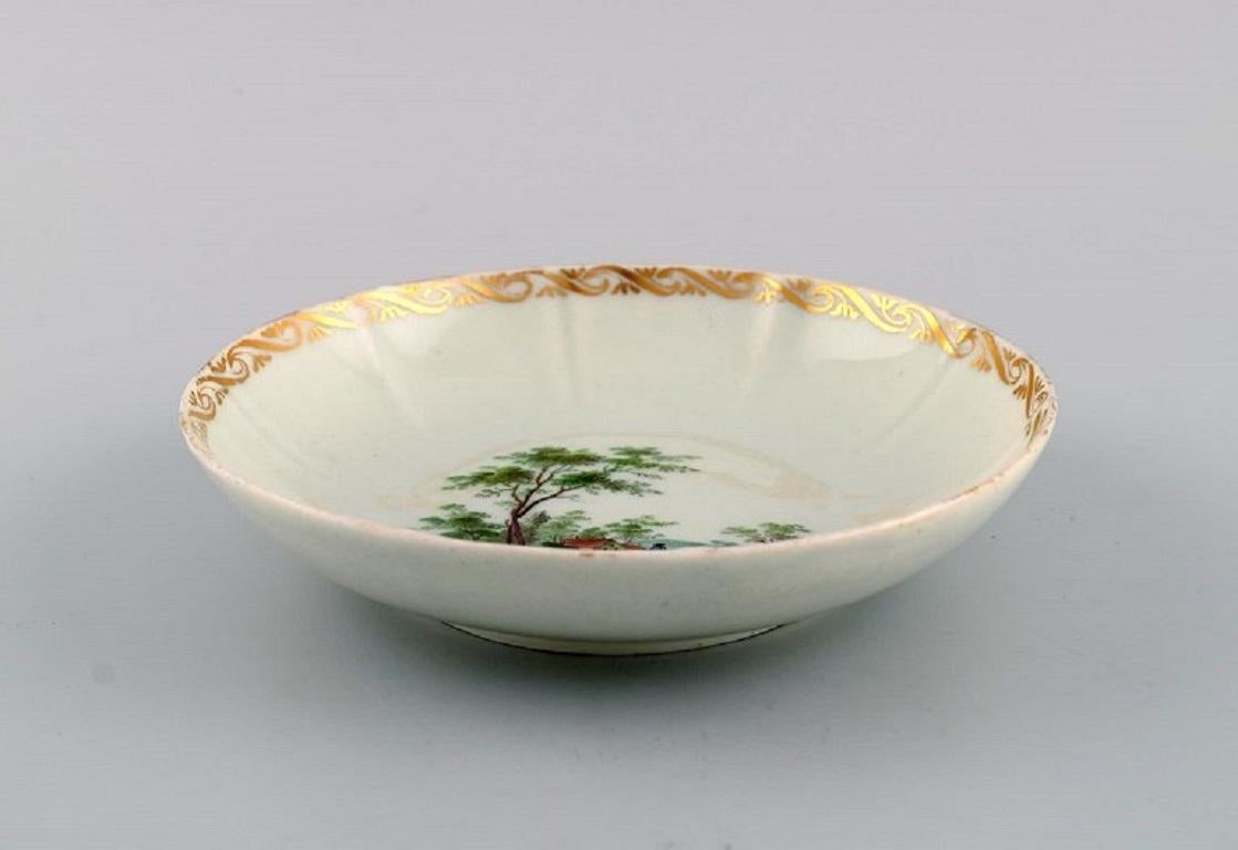 Porcelain Four antique Royal Copenhagen porcelain bowls with hand-painted landscapes. For Sale