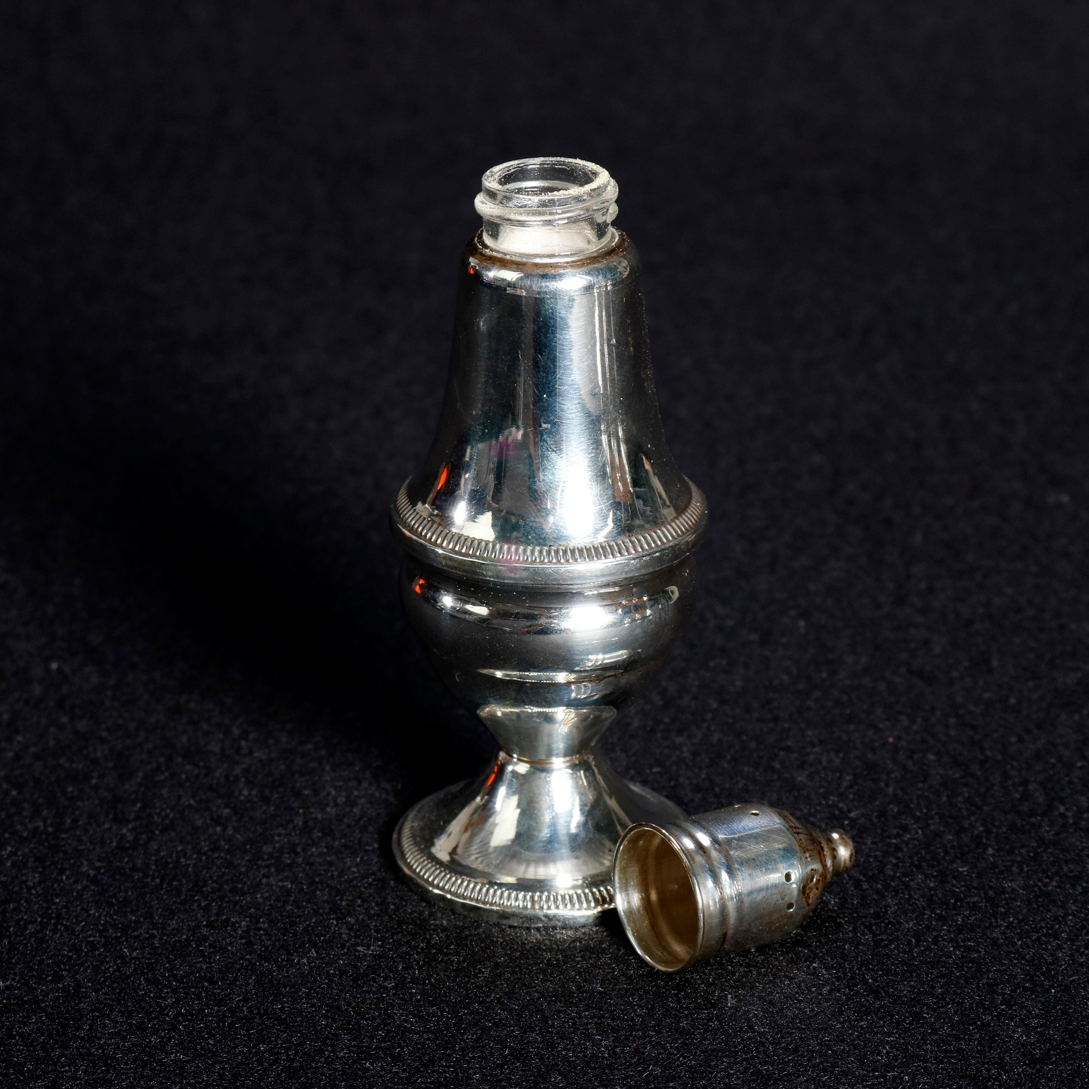 An antique set of 4 sterling silver weighted salt and pepper shakers by Duchin offers urn form with glass liners, marked on base as photographed, circa 1900

Measures: 5