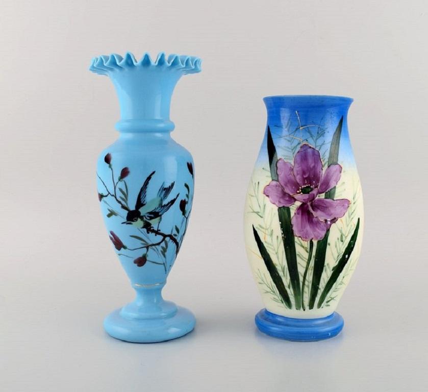 Four antique vases in hand-painted mouth-blown opal art glass in shades of blue and turquoise. 
Approx. 1900.
Largest measures: 27 x 11.5 cm.
In excellent condition.