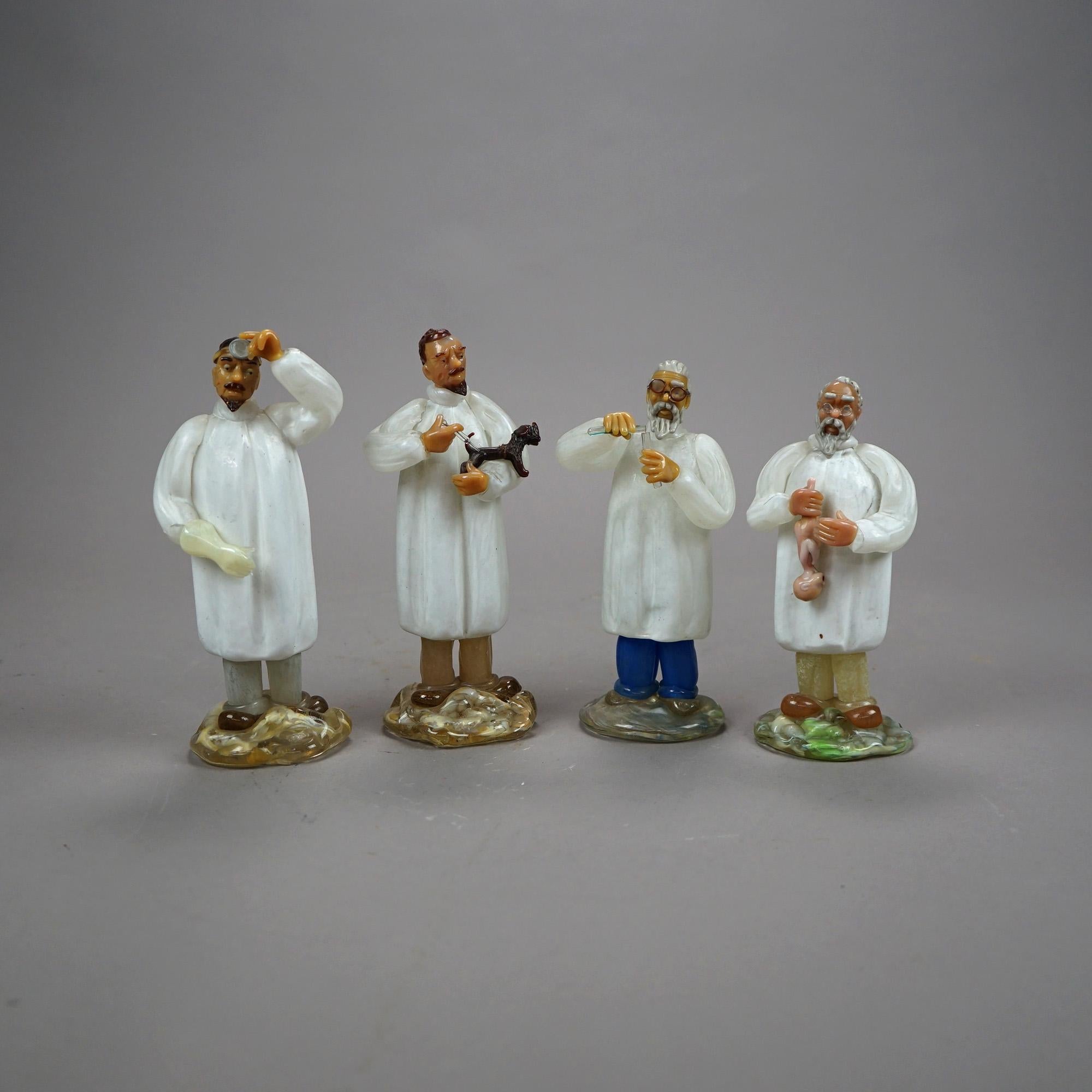 A set of four Czech Arcadia figurines offer blown Murano art glass construction and depict medical professionals including veterinarian, OB-GYN, surgeon and lab chemist, label as photographed, 20th century
 
Measures - OB-GYN 7.5''H x 3.5''W x 3''D;