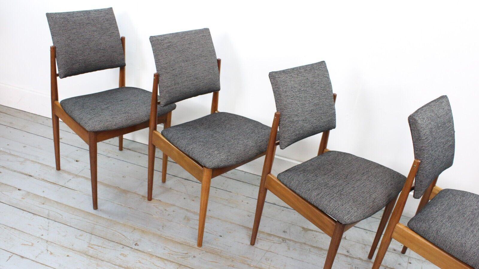 Rarely available and newly upholstered dining chair set designed by Robert Heritage for Archie Shine from 1960.

Four mahogany framed Berkshire range soft back chairs, finished in a dark herringbone grey/light black fabric.

Excellent examples