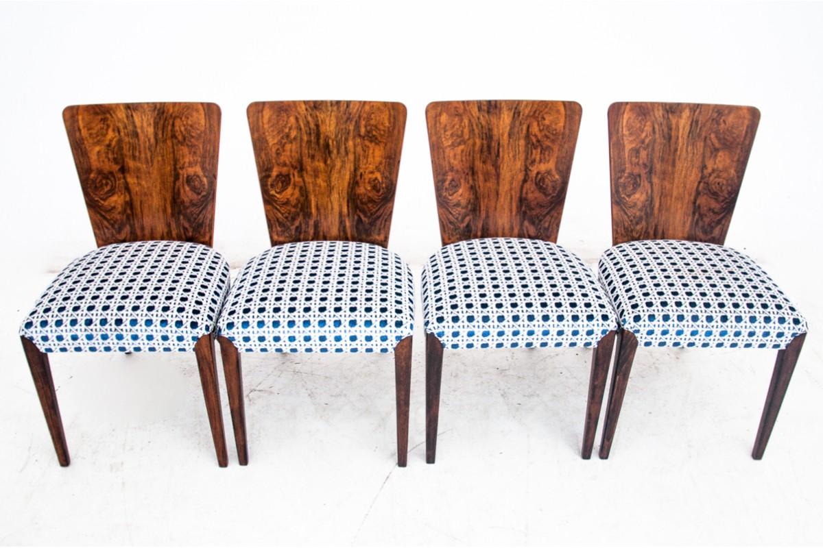 A set of four walnut dining chairs in the Art Deco style.

Model no. H-214 of the iconic designer Jindrich Halabala in the 1930s

Very good condition, after renovation and replacement of the upholstery with high-quality blue and white fabric with