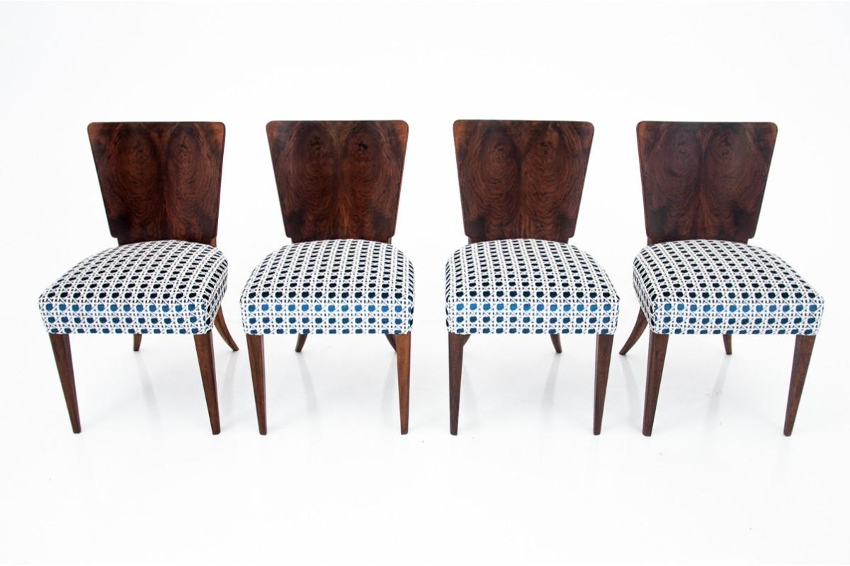 A set of four walnut dining chairs in the Art Deco style.

Model no. H-269 of the iconic designer Jindrich Halabala in the 1930s

Very good condition, after renovation and replacement of the upholstery with high-quality blue and white fabric with