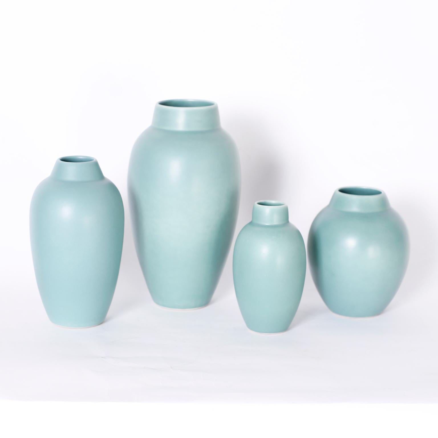 Collection of four art pottery vases with classic modern form and an alluring matte green glaze. Signed on the bottom Bella Vase Venice California. 

From left to right:

H: 10 DM: 5.5
H: 13 DM: 7
H: 7.5 DM: 4
H: 8 DM: 6.