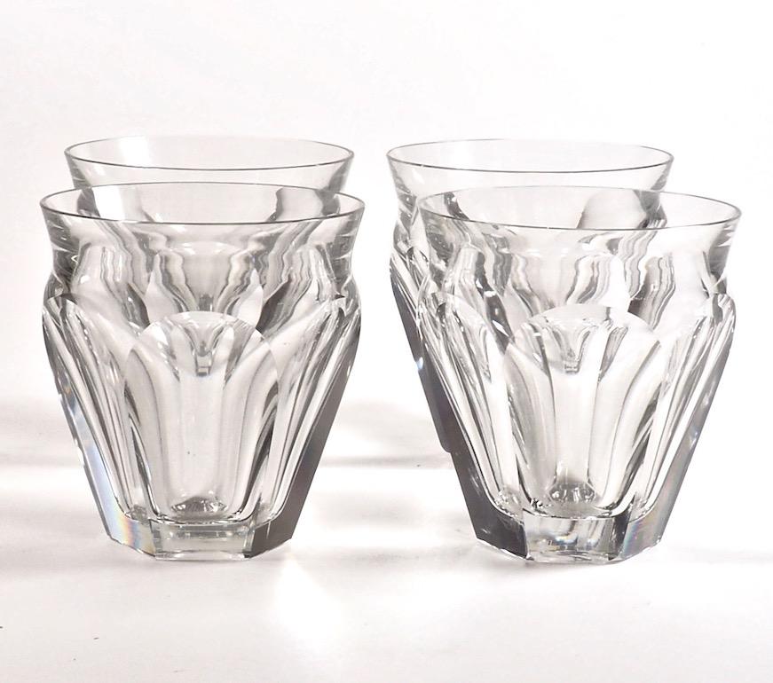 A stylish set of four Baccarat heavy crystal ‘Harcourt Talleyrand’ tumblers with cut glass hexagonal bases. Perfect for any drink even a Negroni or two. Signed, impressed Baccarat France. H 9 x W 8 cm.
 