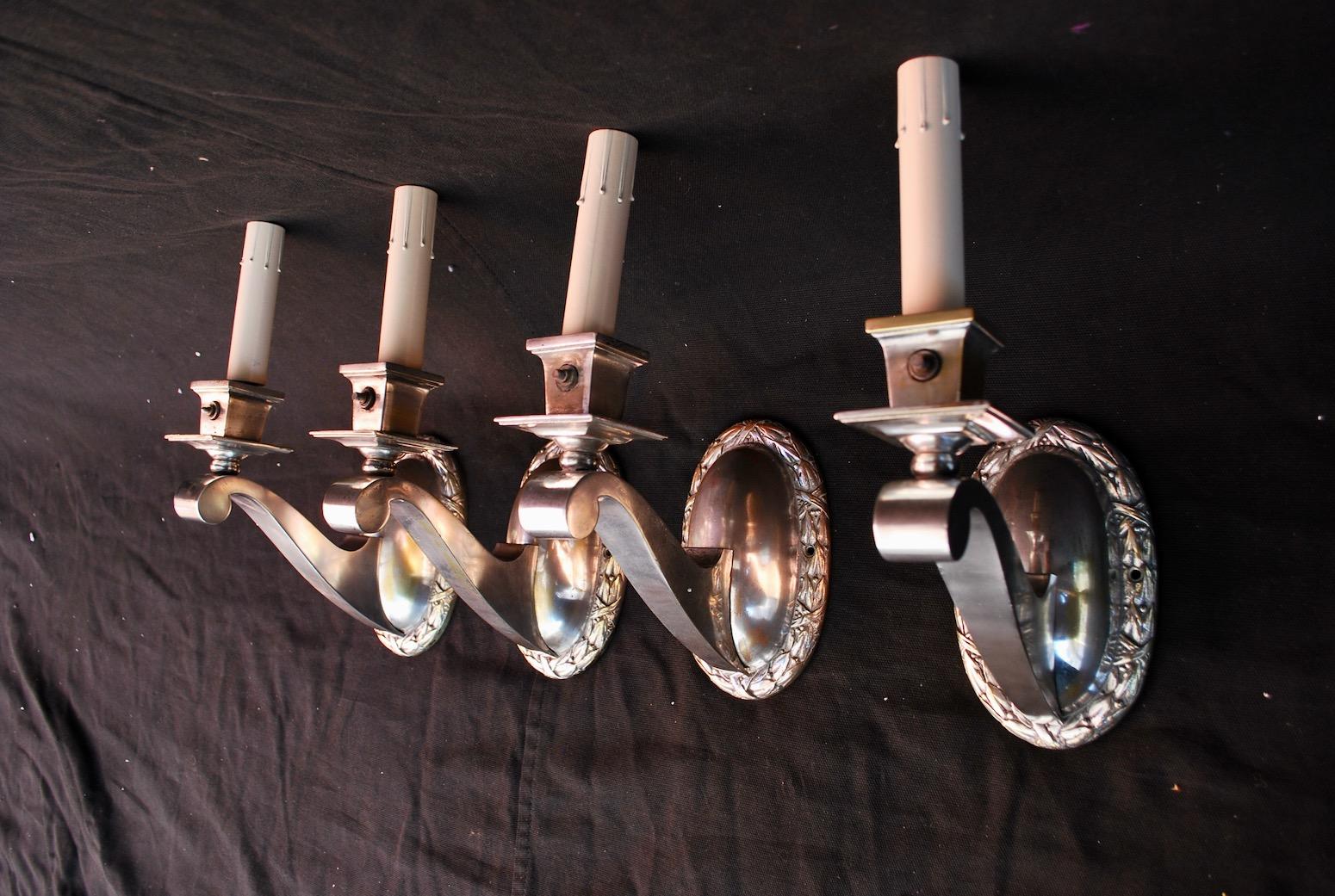 Four beautiful 1920s silver plated sconces.

   