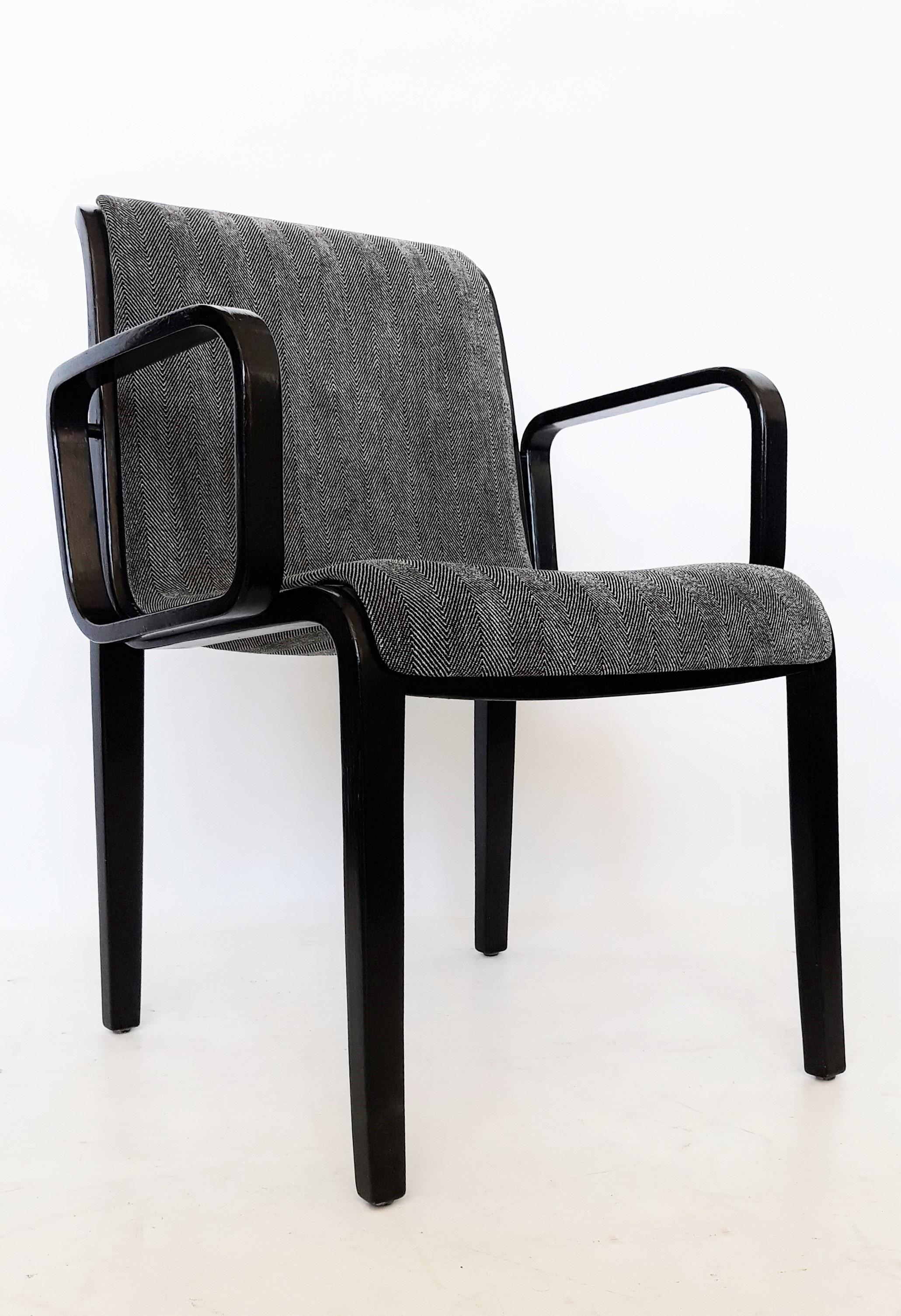 This vintage set of 1300 Series armchairs designed by William 'Bill' Stephens for Knoll. The unique style of Stephens feature gorgeous bent wood frames. Previously lacquered and re-upholstered. Marked to underside of frame. These chairs are