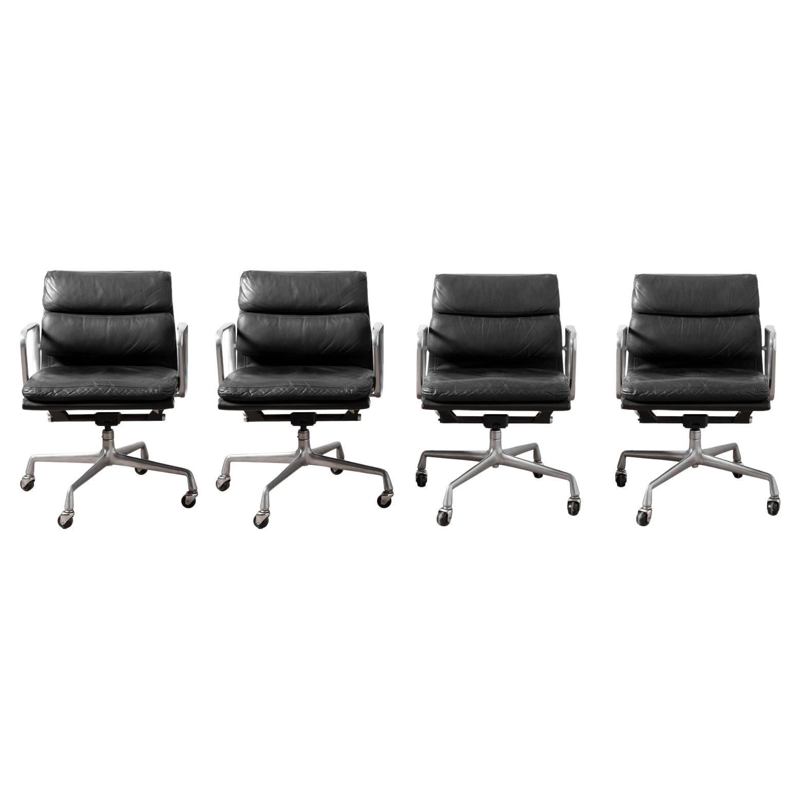 Four Black Leather Herman Miller Charles
Ray Eames Soft Pad Management Chairs