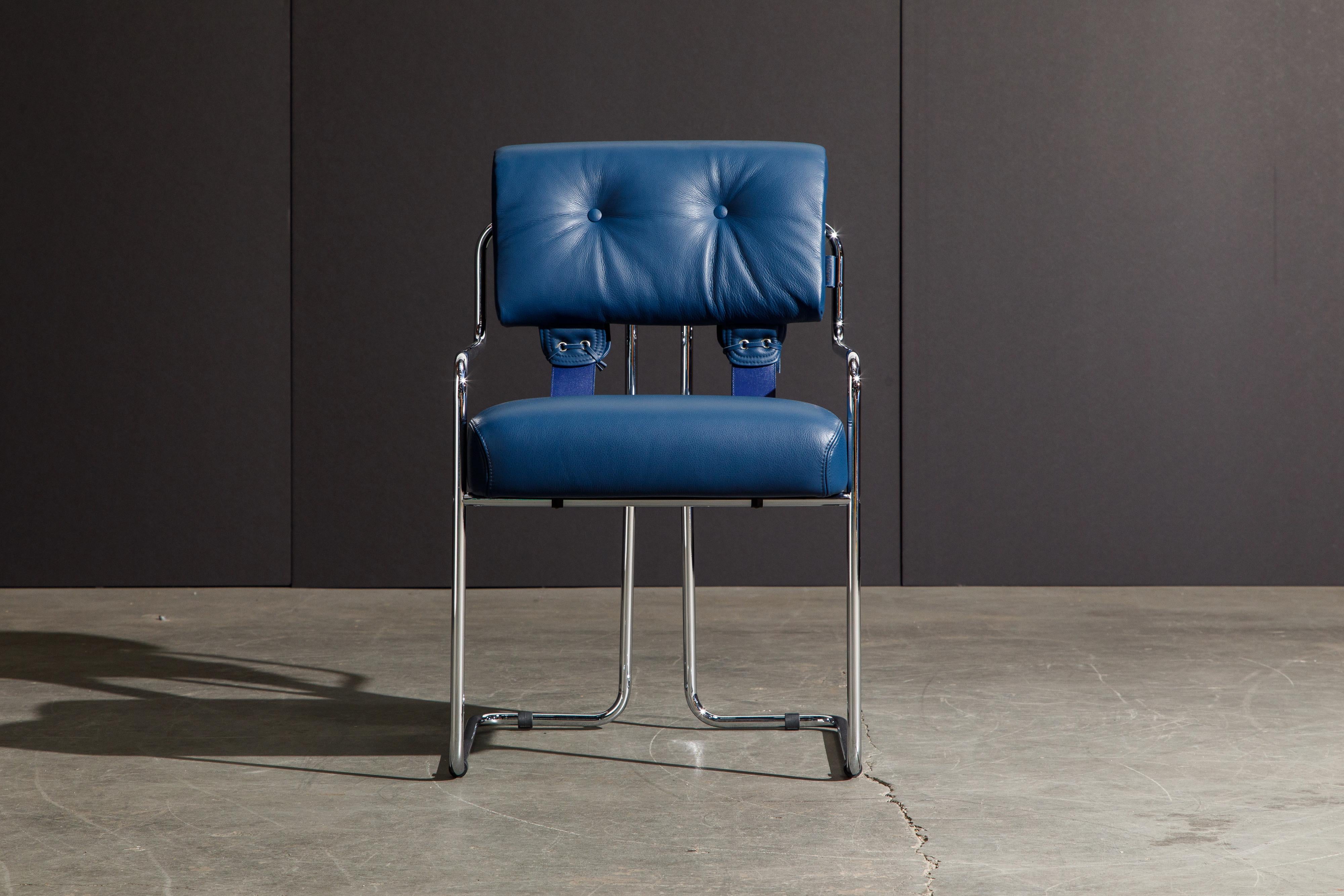 Currently, the most coveted dining chairs by interior designers are 'Tucroma' chairs by Guido Faleschini for i4 Mariani, and we have this incredible set of four (4) Tucroma armchairs in beautiful blue leather with polished chrome frames. The seats