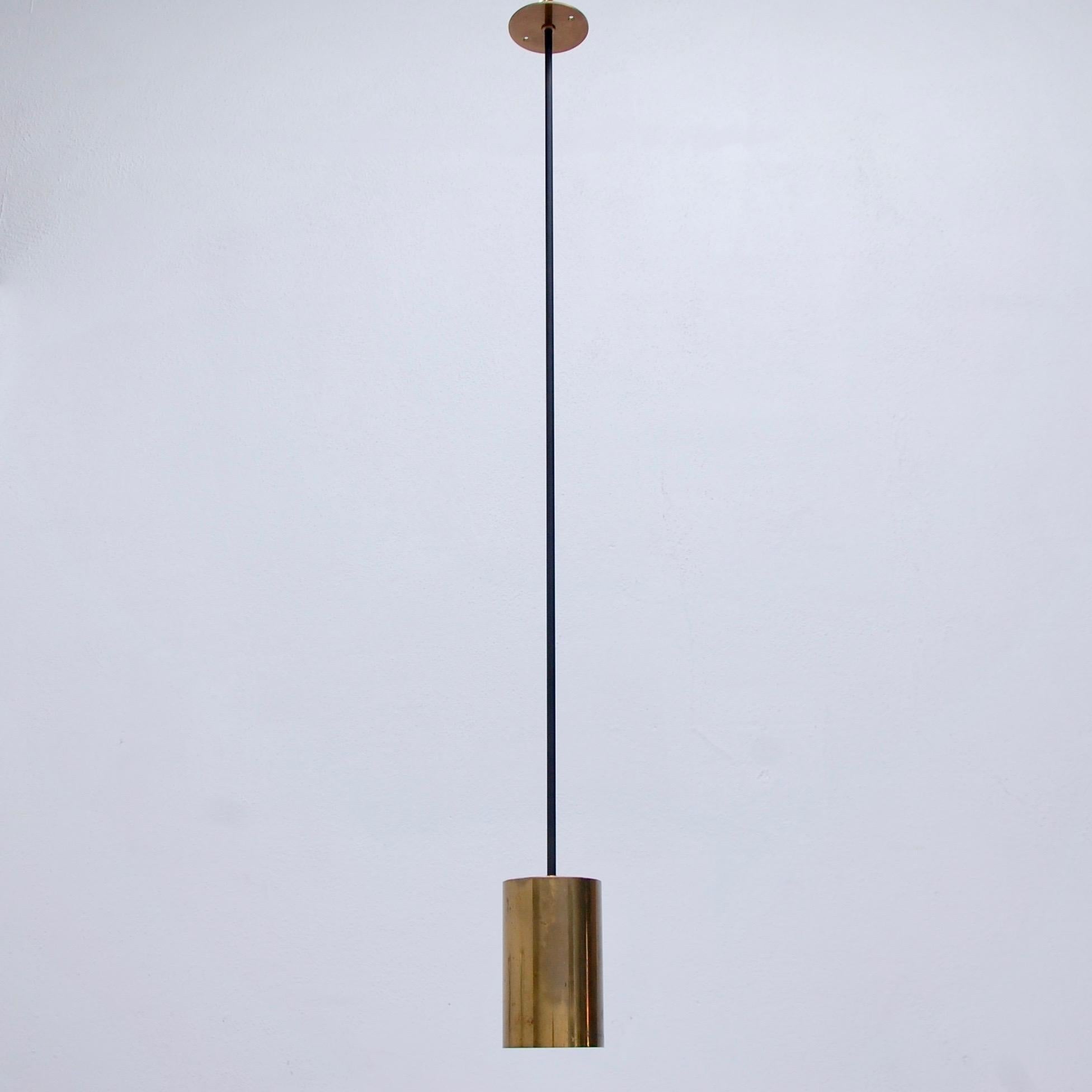 (3) Directional pendants by Boris Lacroix, 1950s France. Brass and painted steel finish. Original aged finish. Wired for use in the US. OAD can be adjusted upon request. Single E26 medium based light socket per pendant. Priced individually. Light