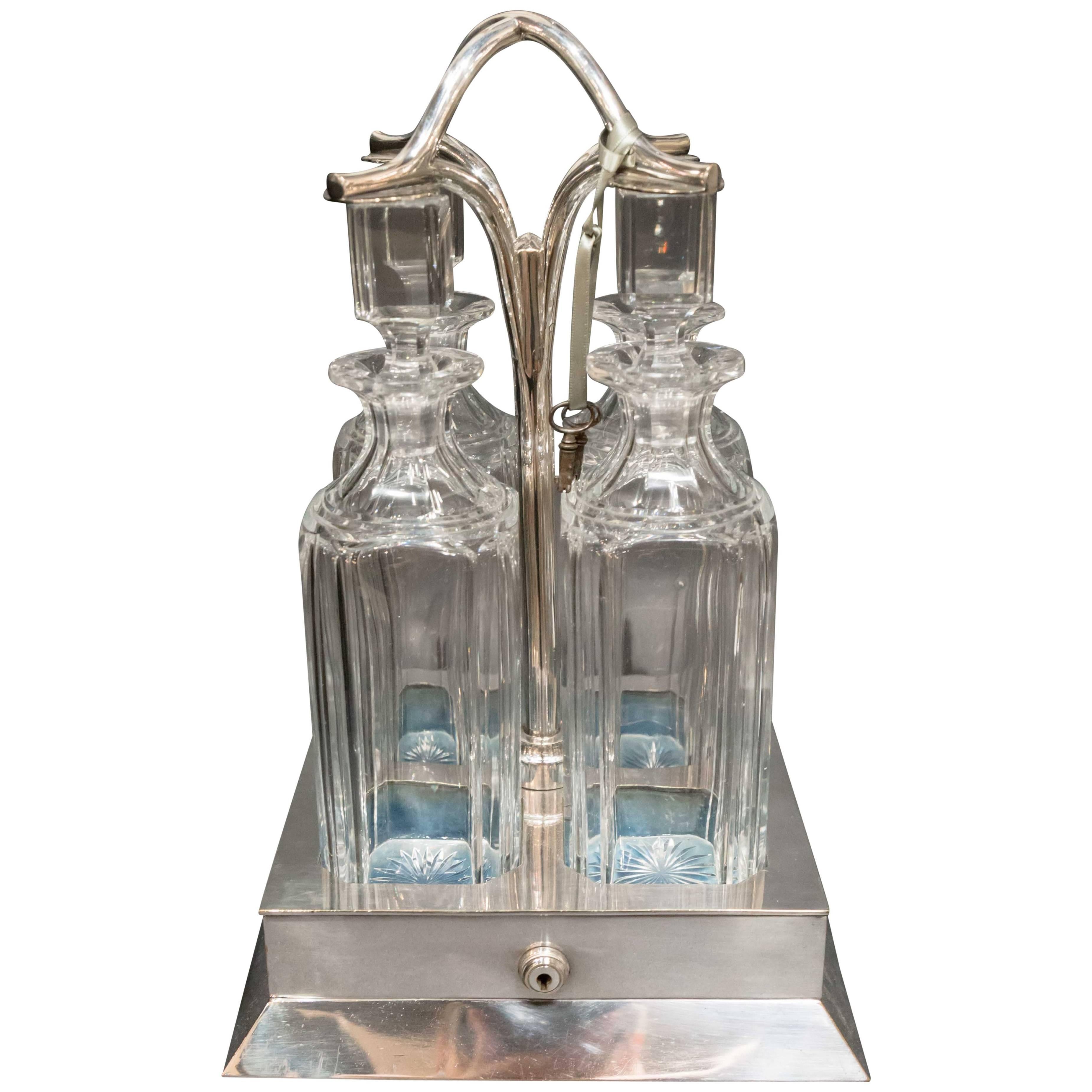 Four Bottle Locking Tanalus with Silver Plate, circa 1890