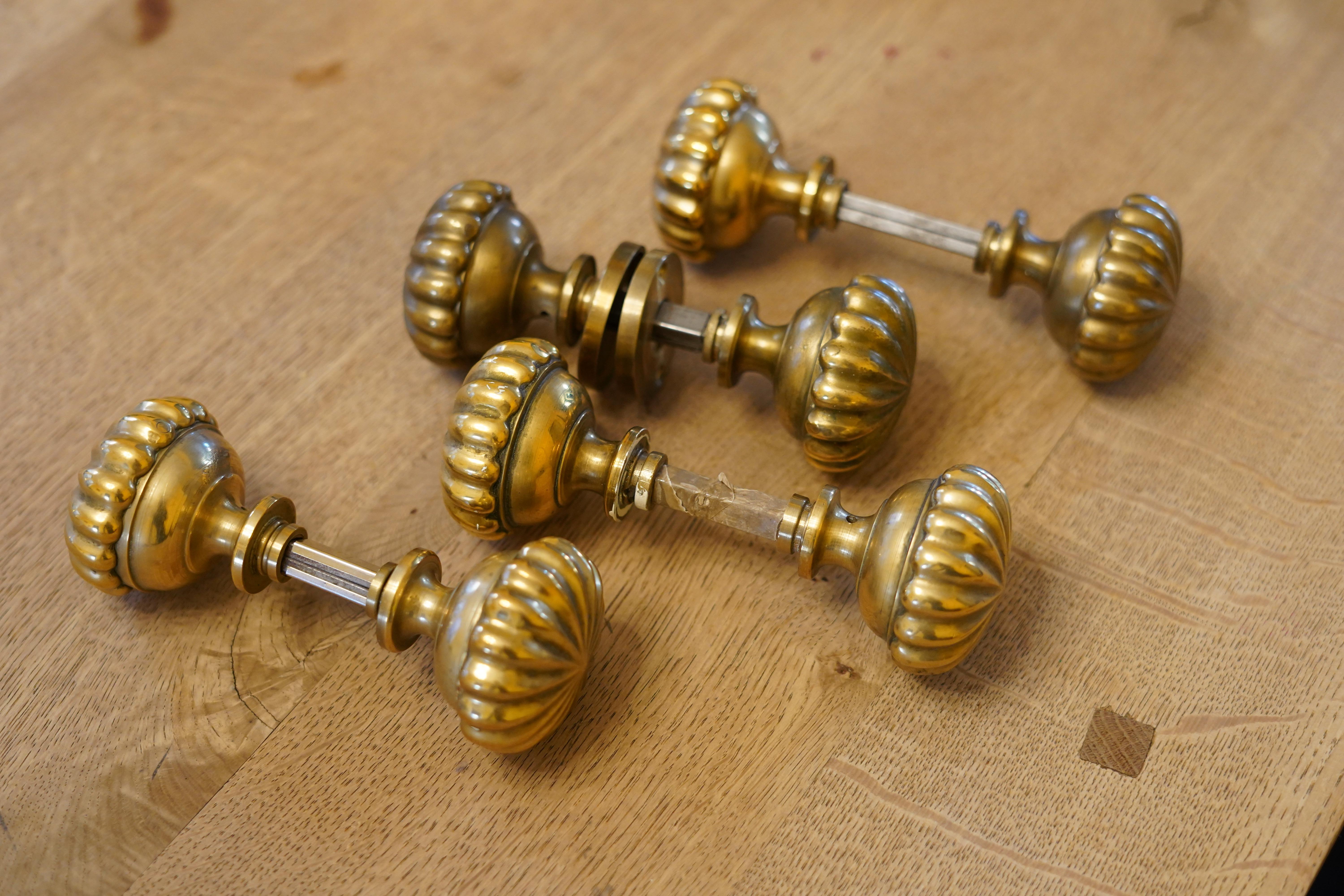 Four Italian brass door handles from the 1940s, comes with plates for keyshole.