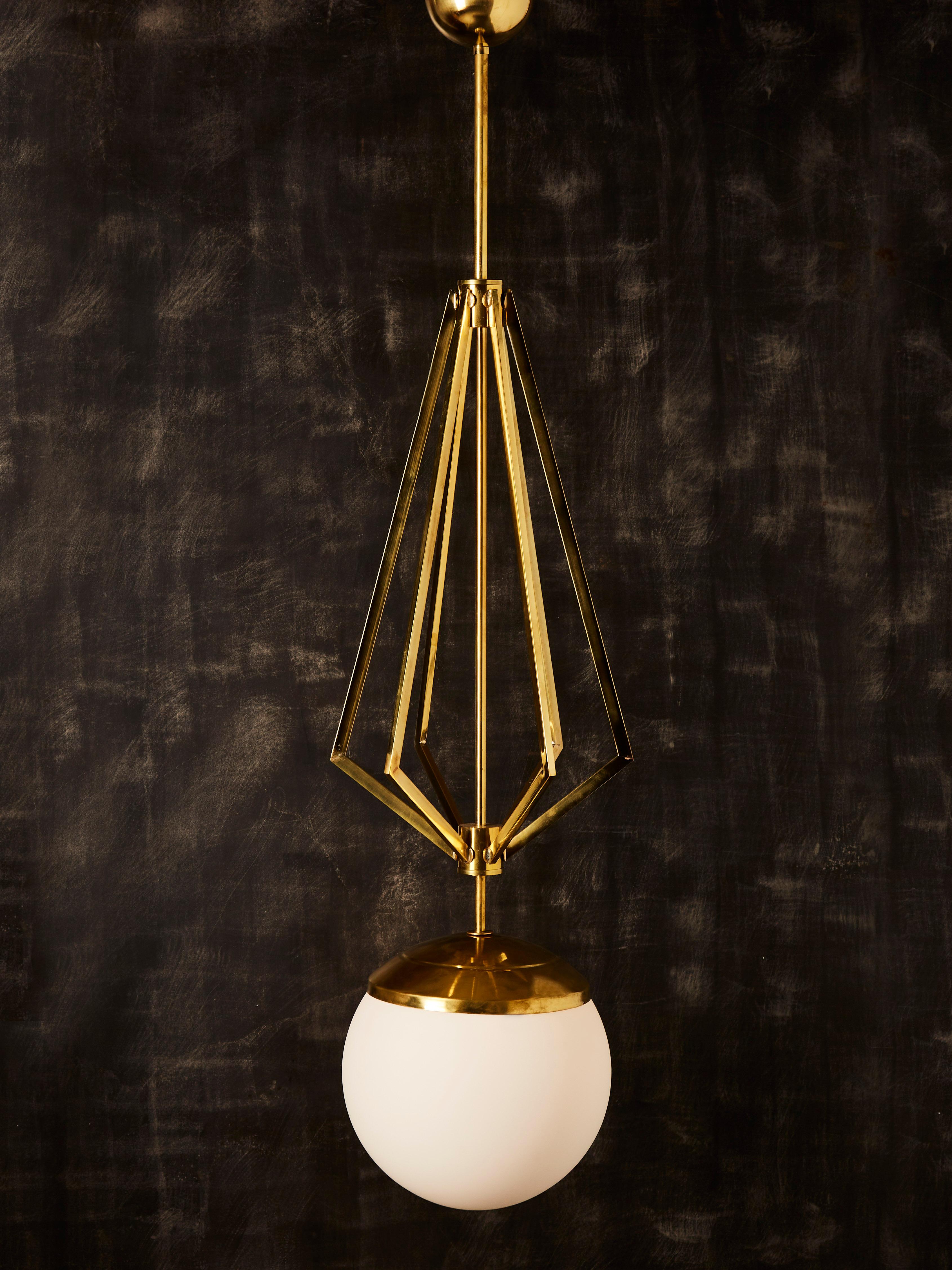 Modern Four Brass Geometrical Suspension with a Large White Glass Globe For Sale