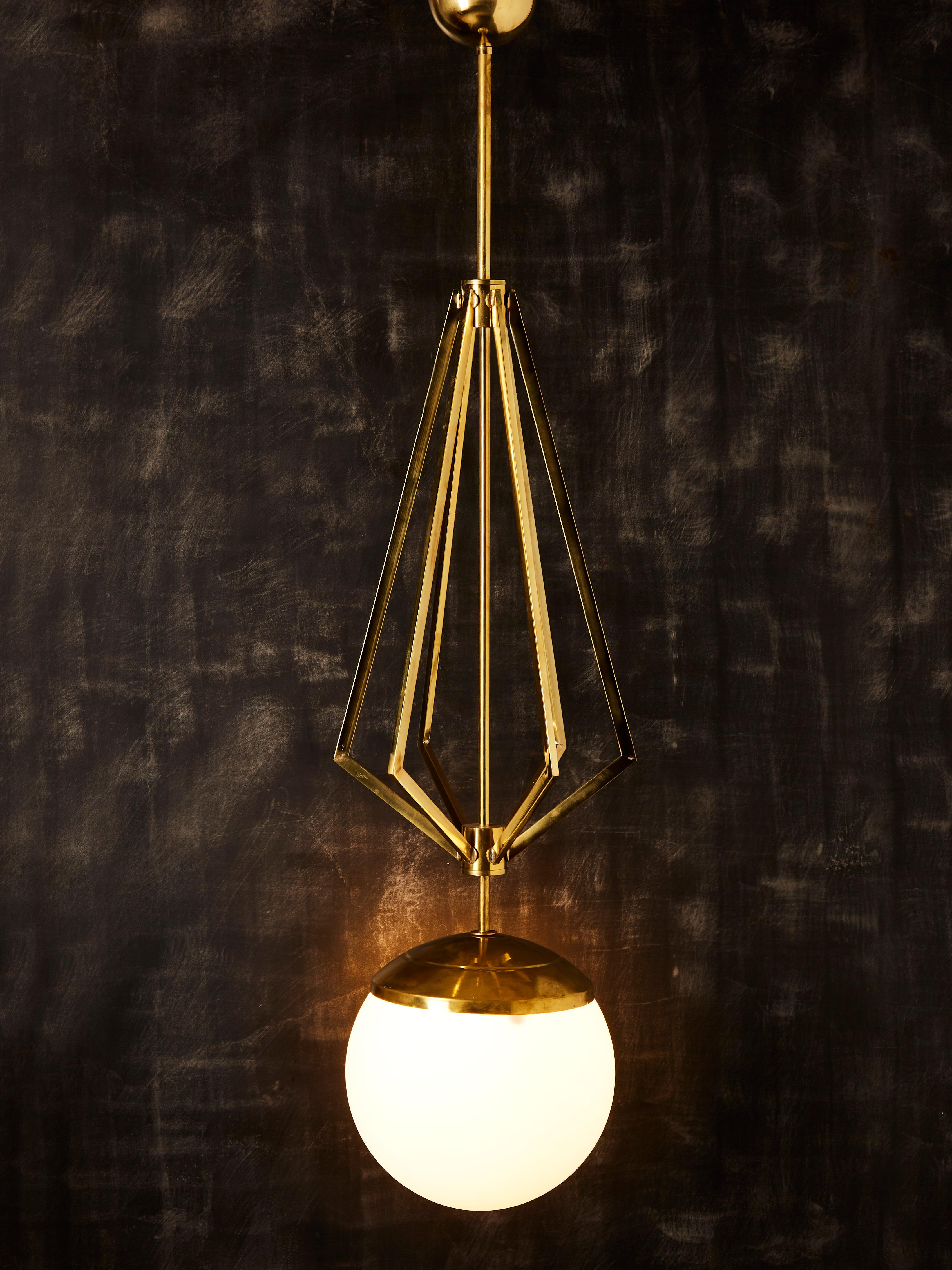 Italian Four Brass Geometrical Suspension with a Large White Glass Globe For Sale