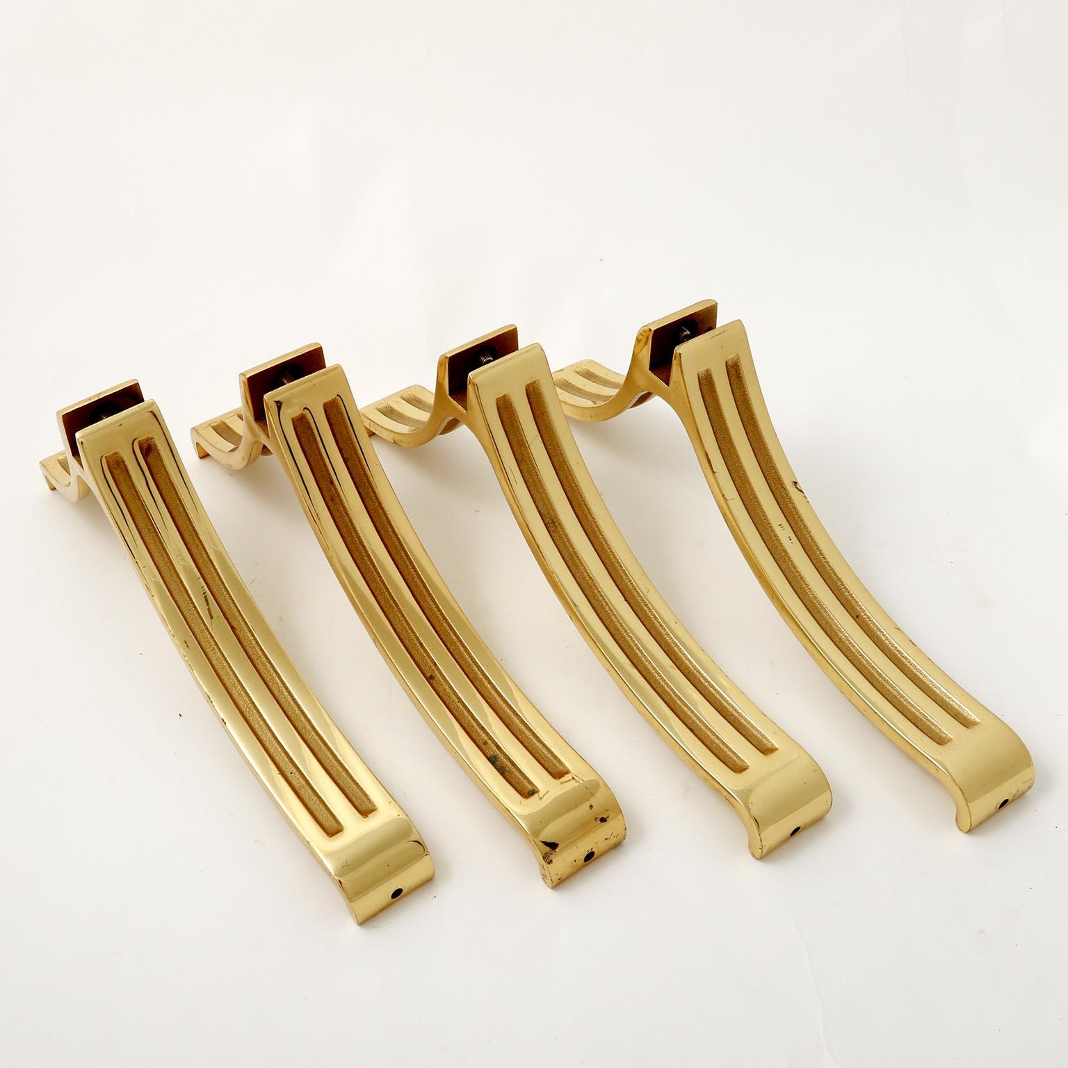 A set of four curved and polished brass legs manufactured in midcentury, circa 1970 (late 1960s or early 1970s).
They can be used for different cases: tables, floor or full length mirrors, sideboards, beds, etc.
Very good condition with little and