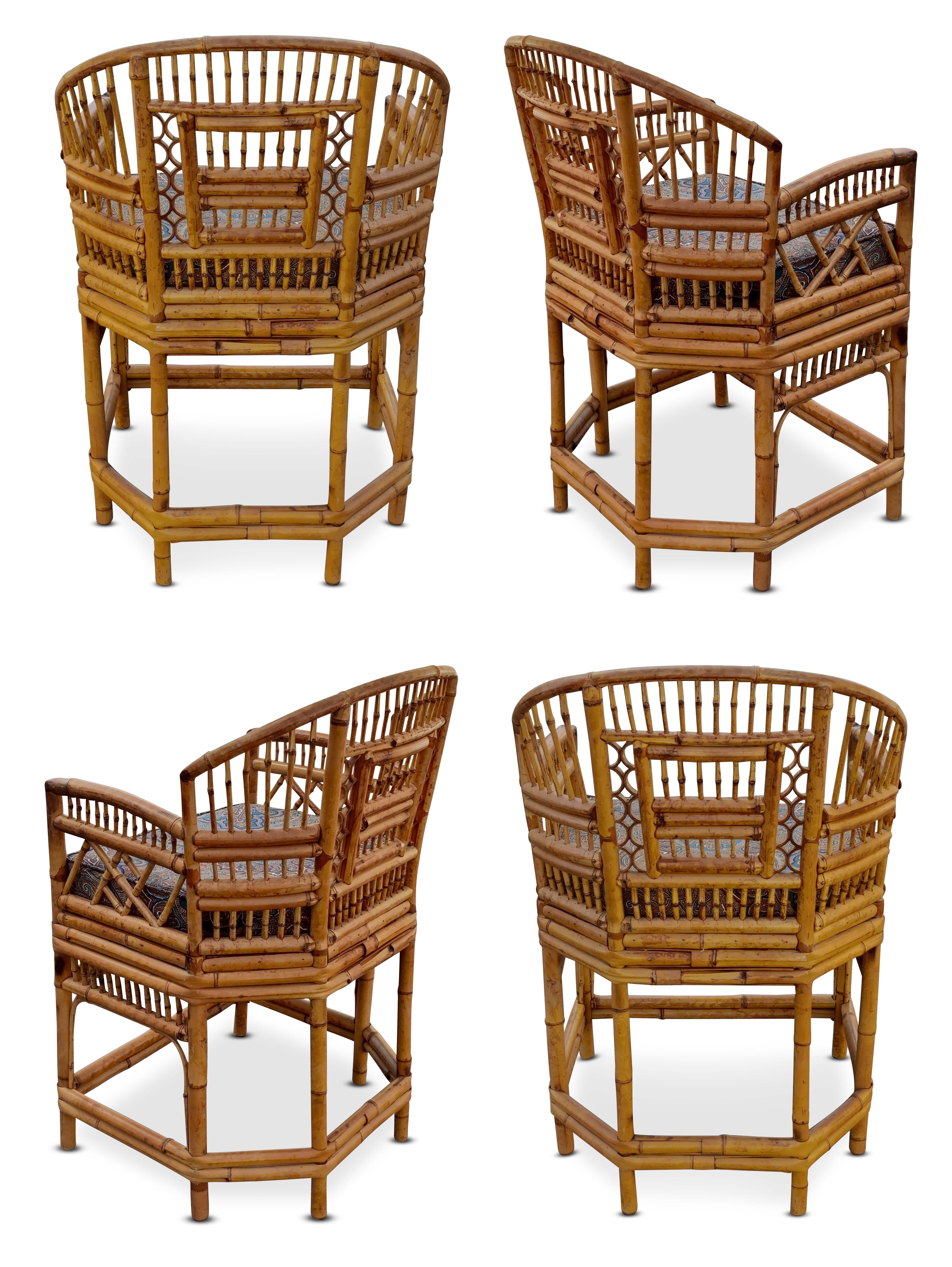 A set of four Chinoiserie bamboo and cane armchairs, in the Brighton Pavilion style, manufactured by Thomasville, all having brass labels. A timeless design featuring intricate inset geometric and foliate bamboo openwork on each side, and smooth