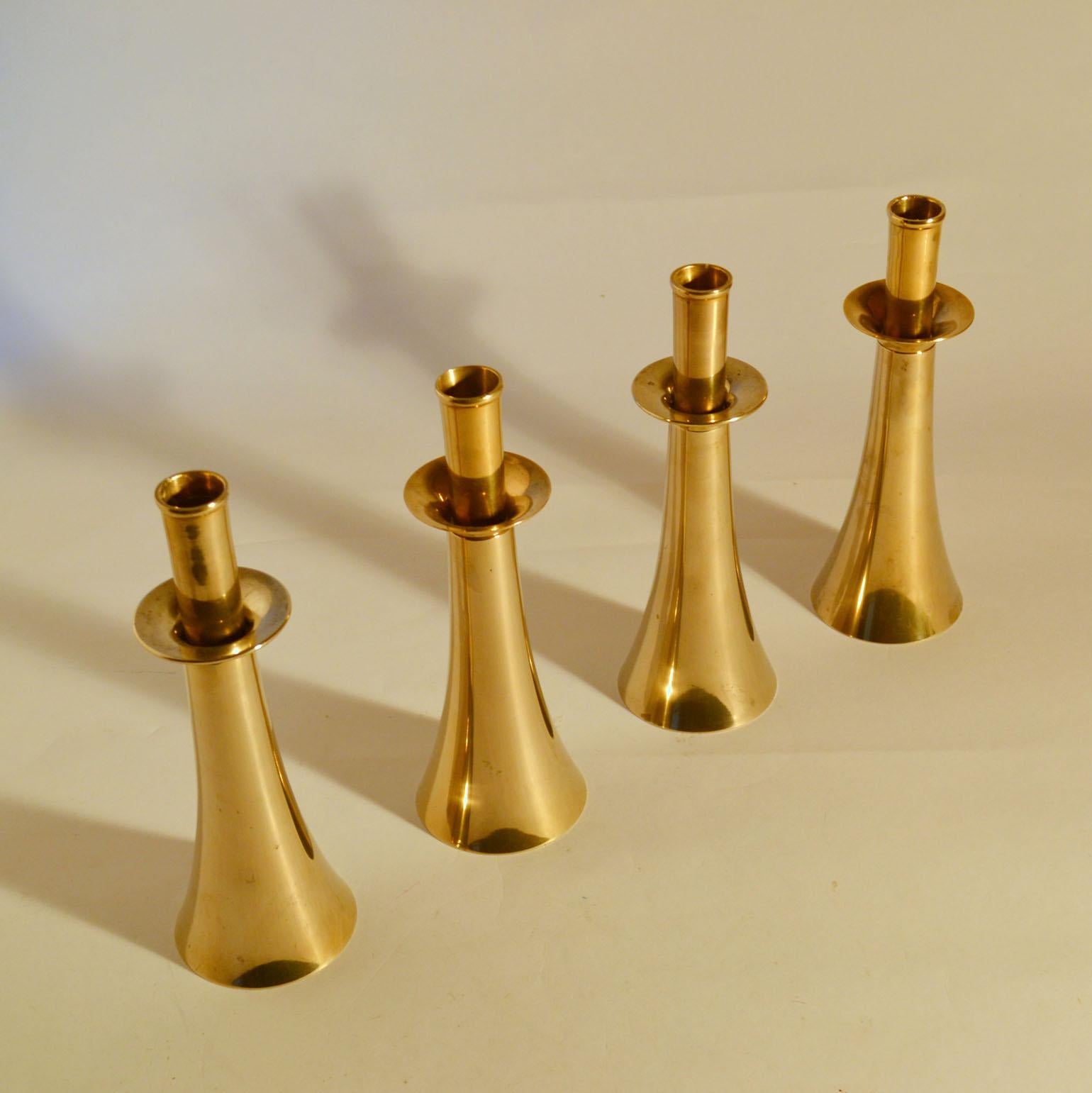 Set of four Harald Quistgaard (1919-2008) Danish bell shaped bronze cast candle holders for regular size candles.
Measures: Height with the candles included 44 cm.