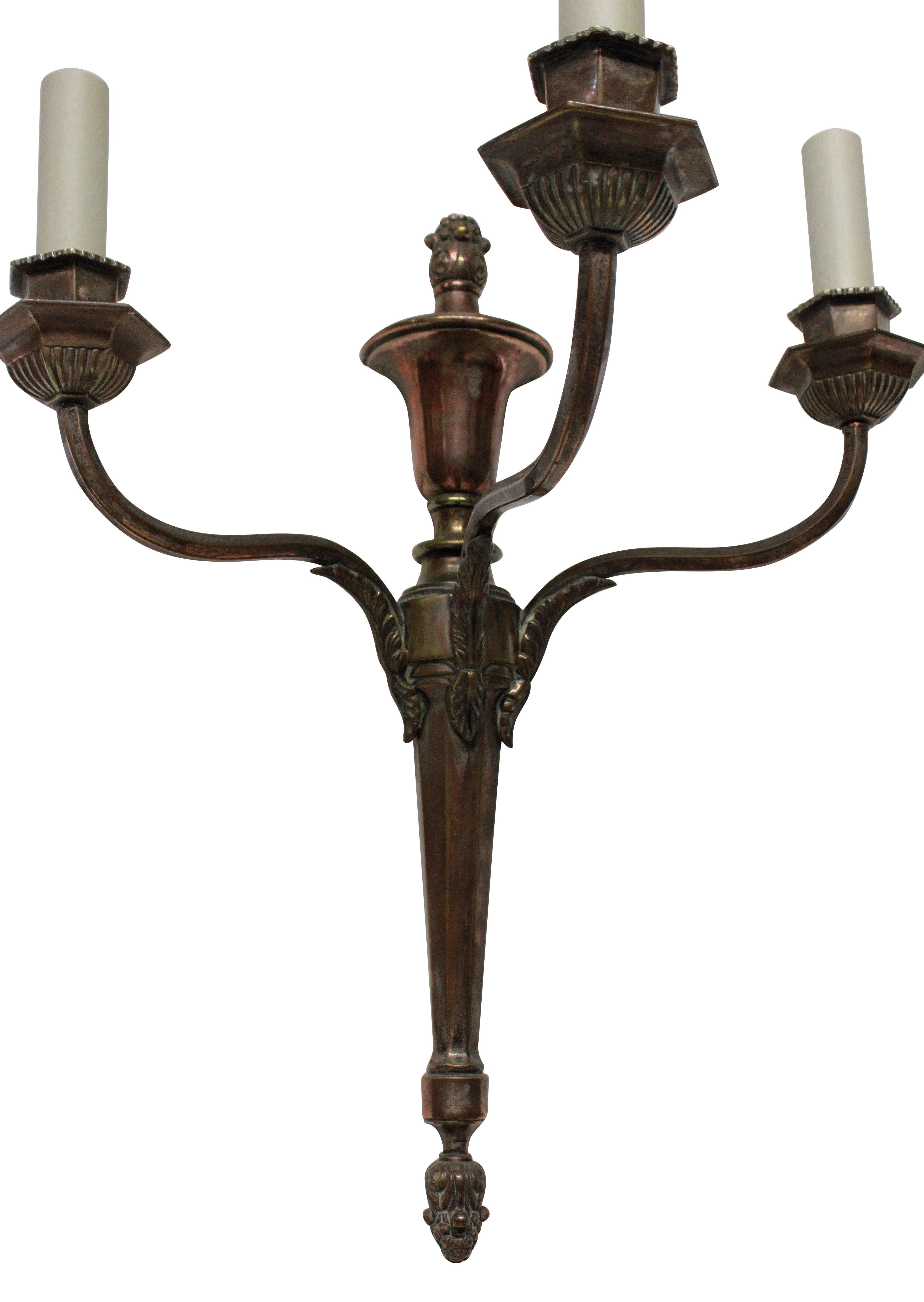 Four Bronzed Neoclassical Three-Branch Sconces In Good Condition In London, GB