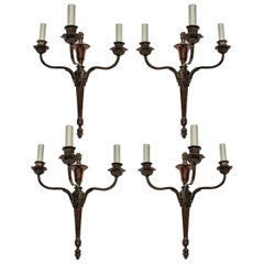 Four Bronzed Neoclassical Three-Branch Sconces