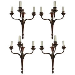 Four Bronzed Neoclassical Three-Branch Sconces