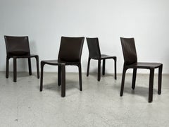 Four Brown Leather Cab Chairs by Mario Bellini