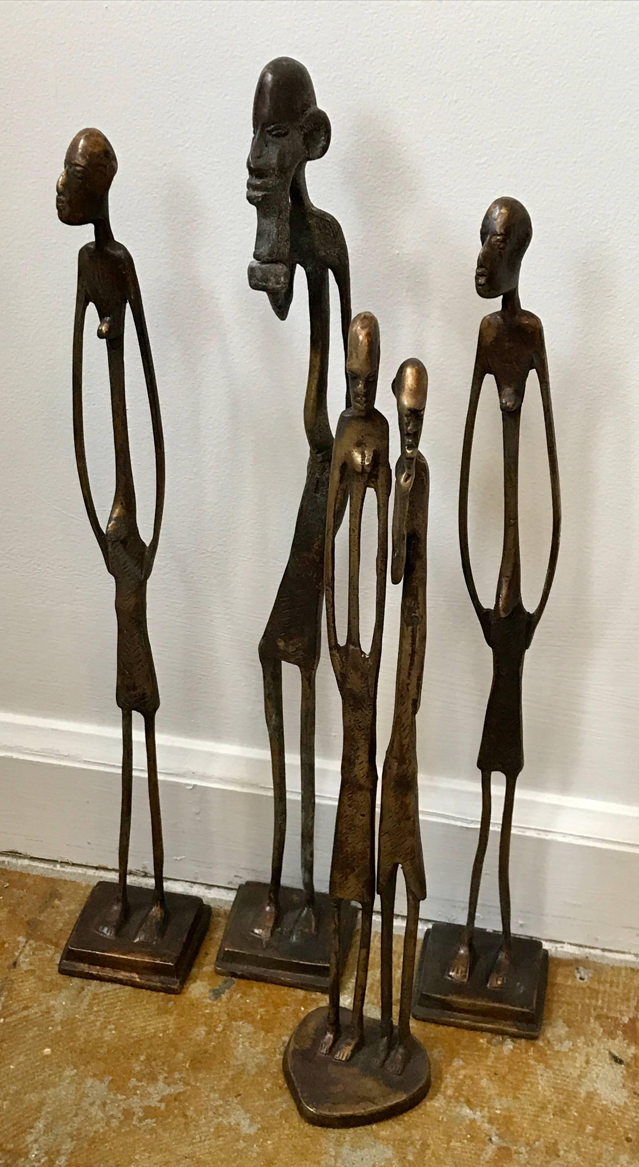Very cool grouping of four abstract figural sculptures in the style of Giocometti, cast in bronze.