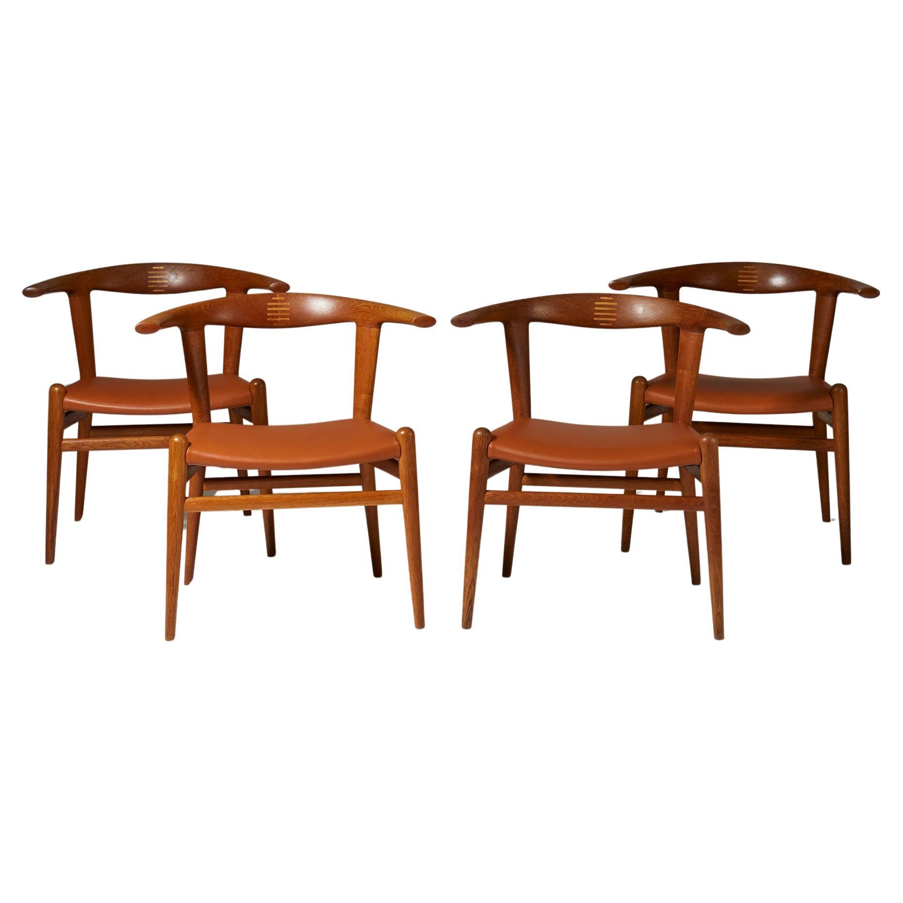 Four 'Bull' armchairs modelJH 518 Designed by Hans J. Wegner for Johannes Hansen