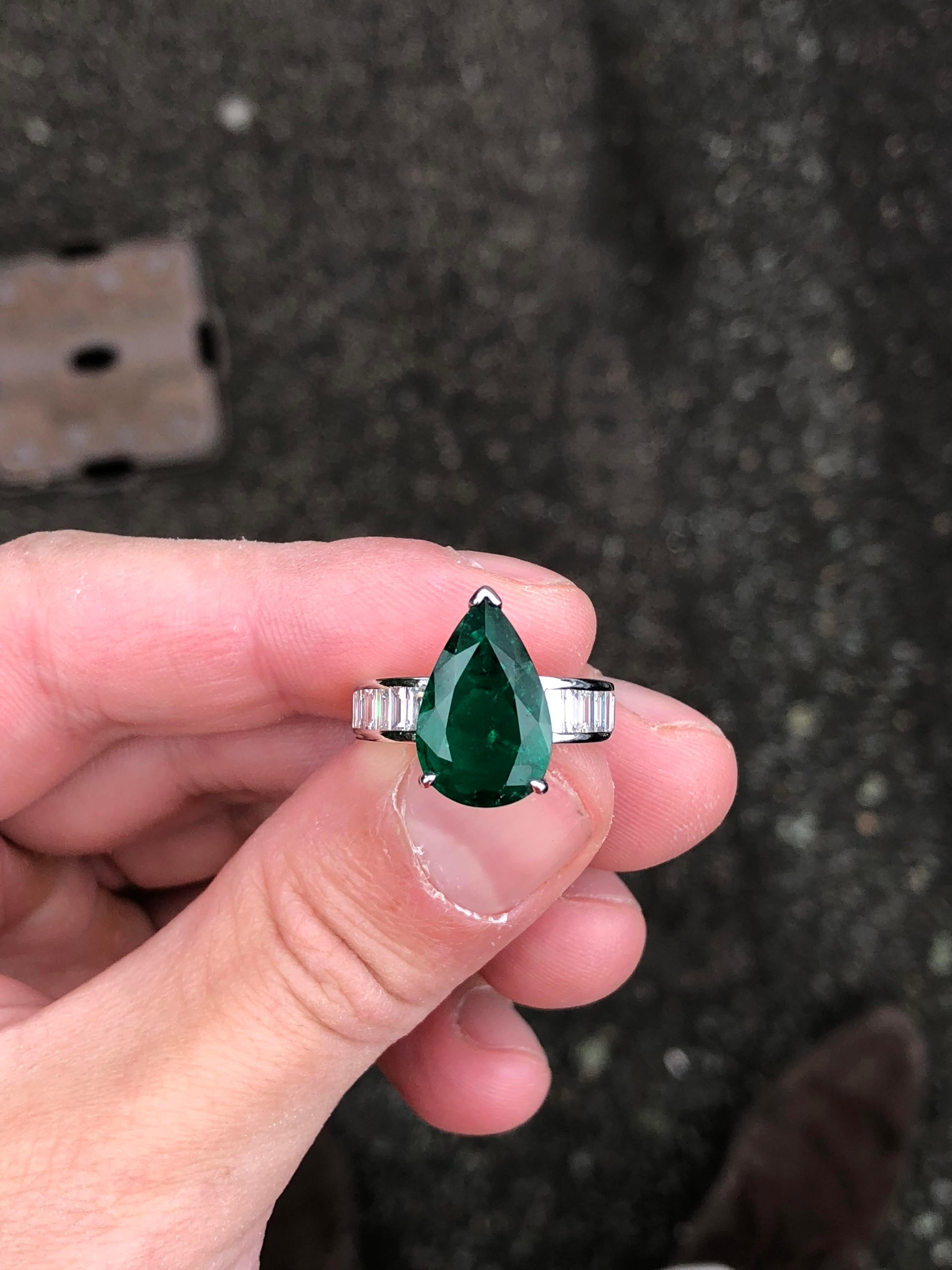 Women's or Men's Four Carat Pear Cut, Colombian Emerald Flanked with Diamonds & Set in White Gold For Sale