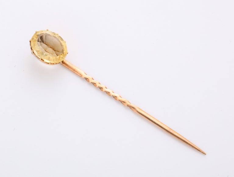 Do look at the gold setting of this beautiful citrine stickpin from c. 1880, the Victorian Era. A small piece of jewelry yet set like a masterpiece with a tiara 15 Kt gold setting both important and elegant.
The 5 ct clear oval citrine and pin are