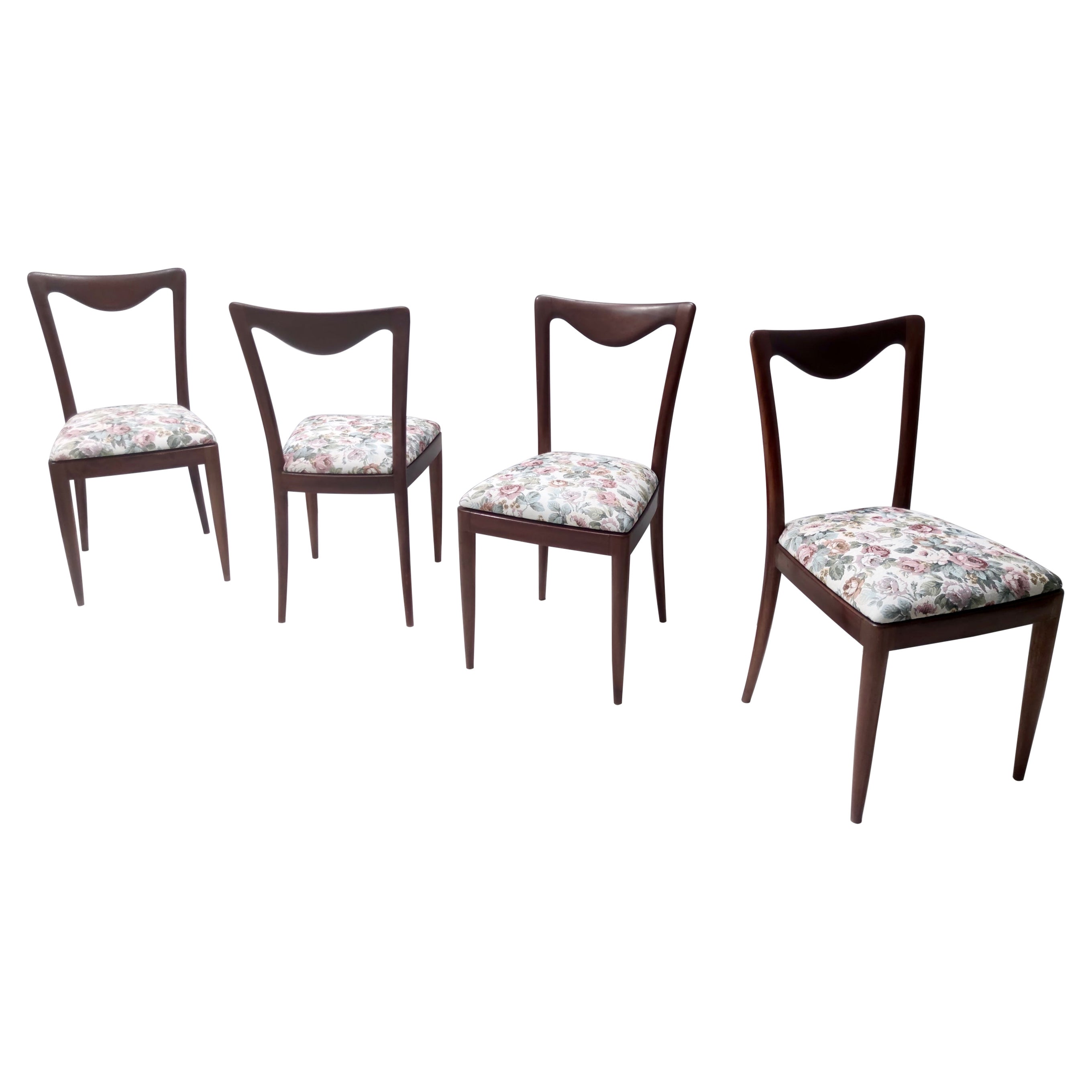 Made in Italy, 1950s. 
This high-quality set features a hand-modeled solid beech frame with their original flower patterned linen fabric upholstery.. 
Their design is by the architect Carlo Enrico Rava. 
They have been recently re-padded.
These